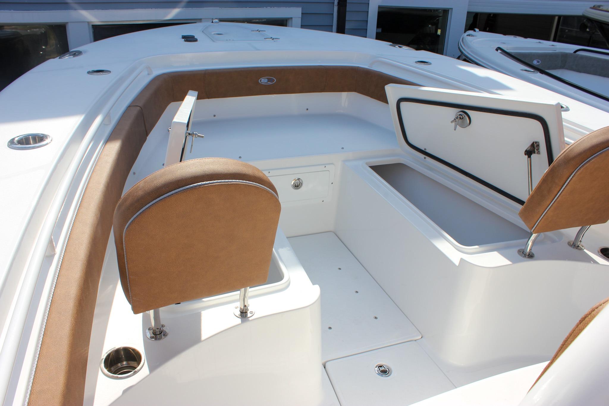 Interior view of 2027 Sea Hunt Ultra 275 SE boat with seating and storage compartments.