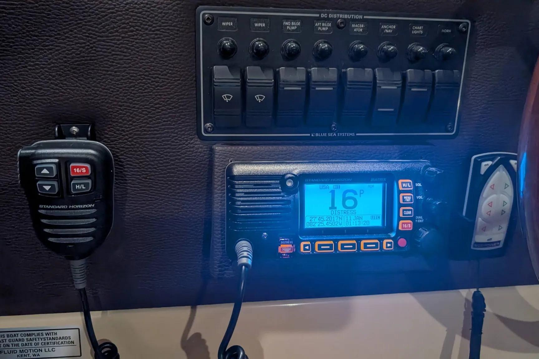 Control panel of a 2015 Ranger Tugs R-29 S with radio and switches.