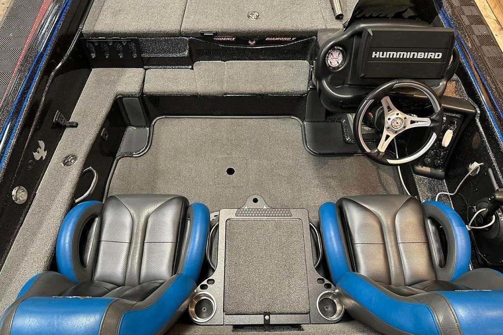 Interior of a 2017 Phoenix 919 ProXP boat with dual seats and Humminbird electronics.