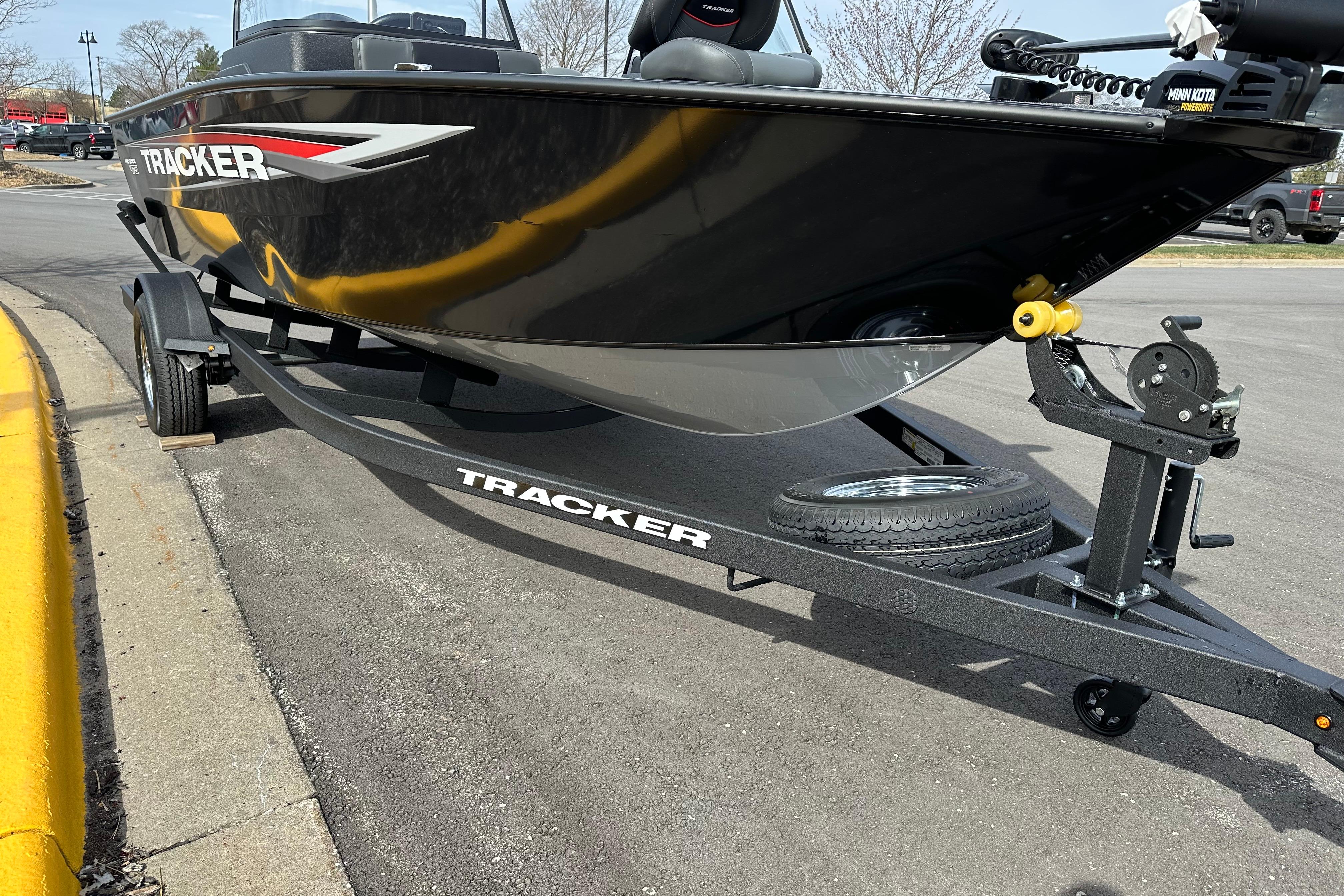 2026 Tracker Pro Guide V-175 Combo boat on trailer, parked outdoors.