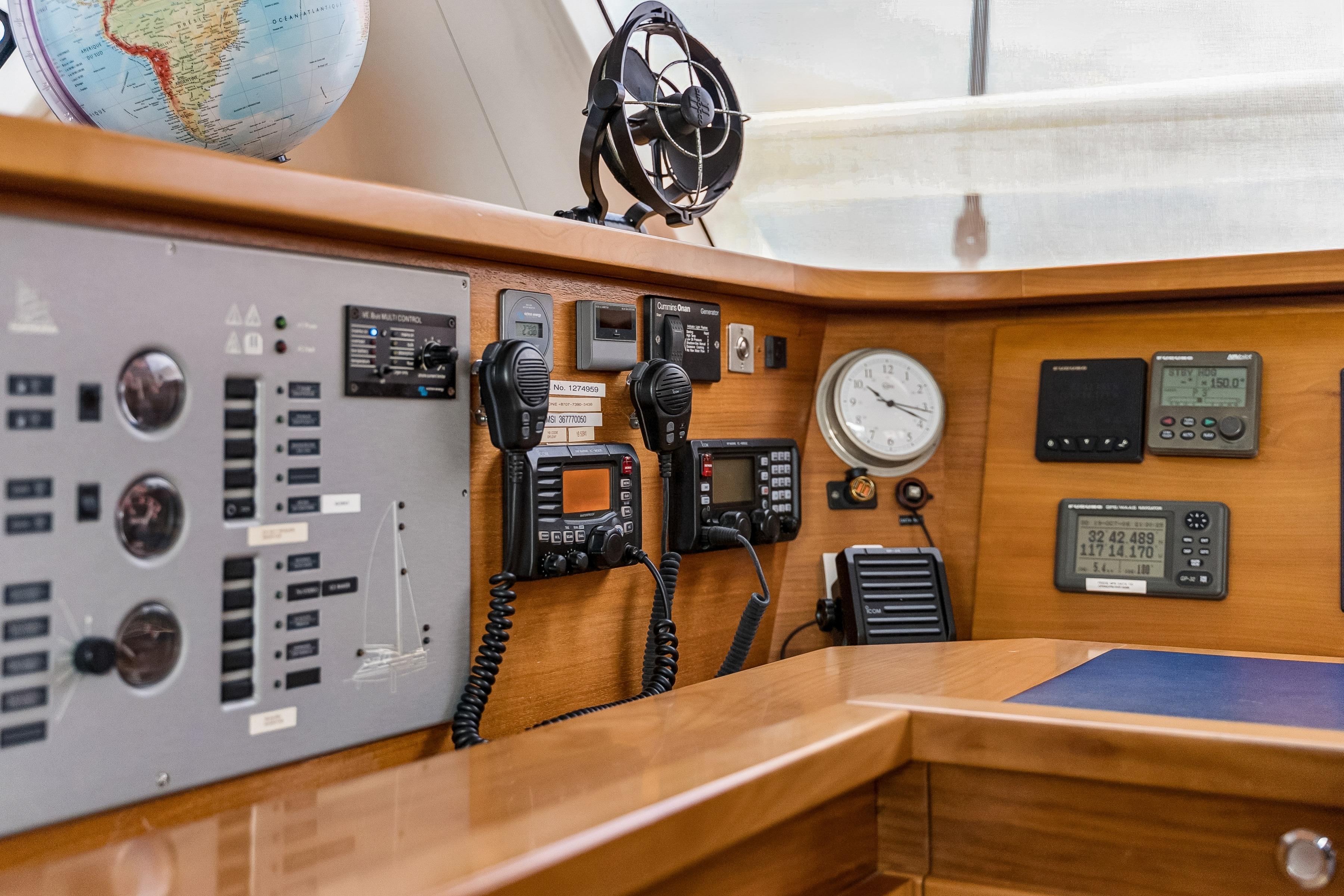Navigation equipment on a 2009 Catana 65 yacht, featuring control panels and communication devices.