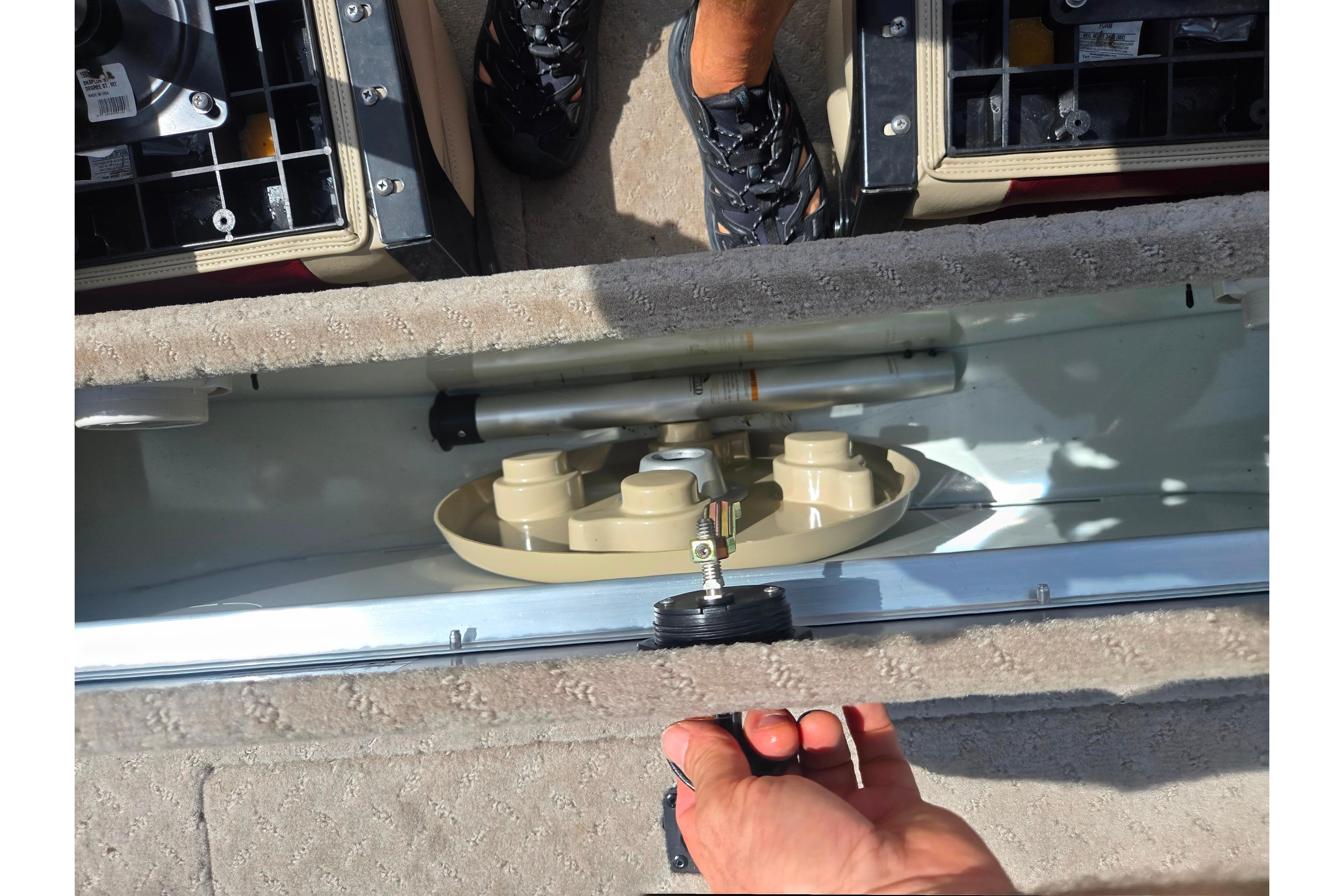 Interior view of a 2015 Lowe Sport Deck 224 boat storage compartment.