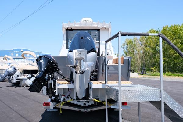 2023 Makaira Gen3 800 boat with dual outboard motors on display.