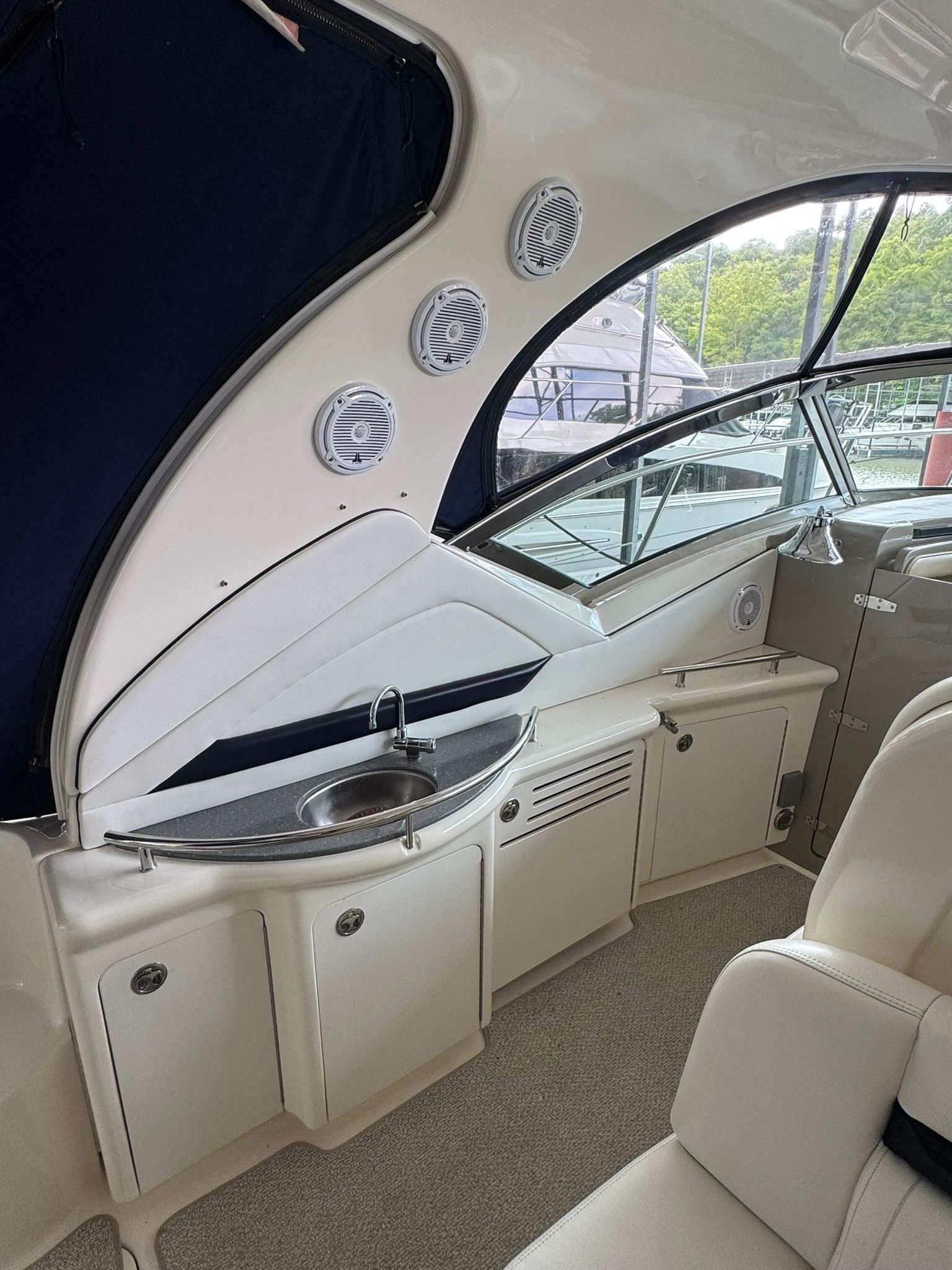 Interior of the 2007 Sea Ray 40 Sundancer with sleek kitchenette and panoramic window.