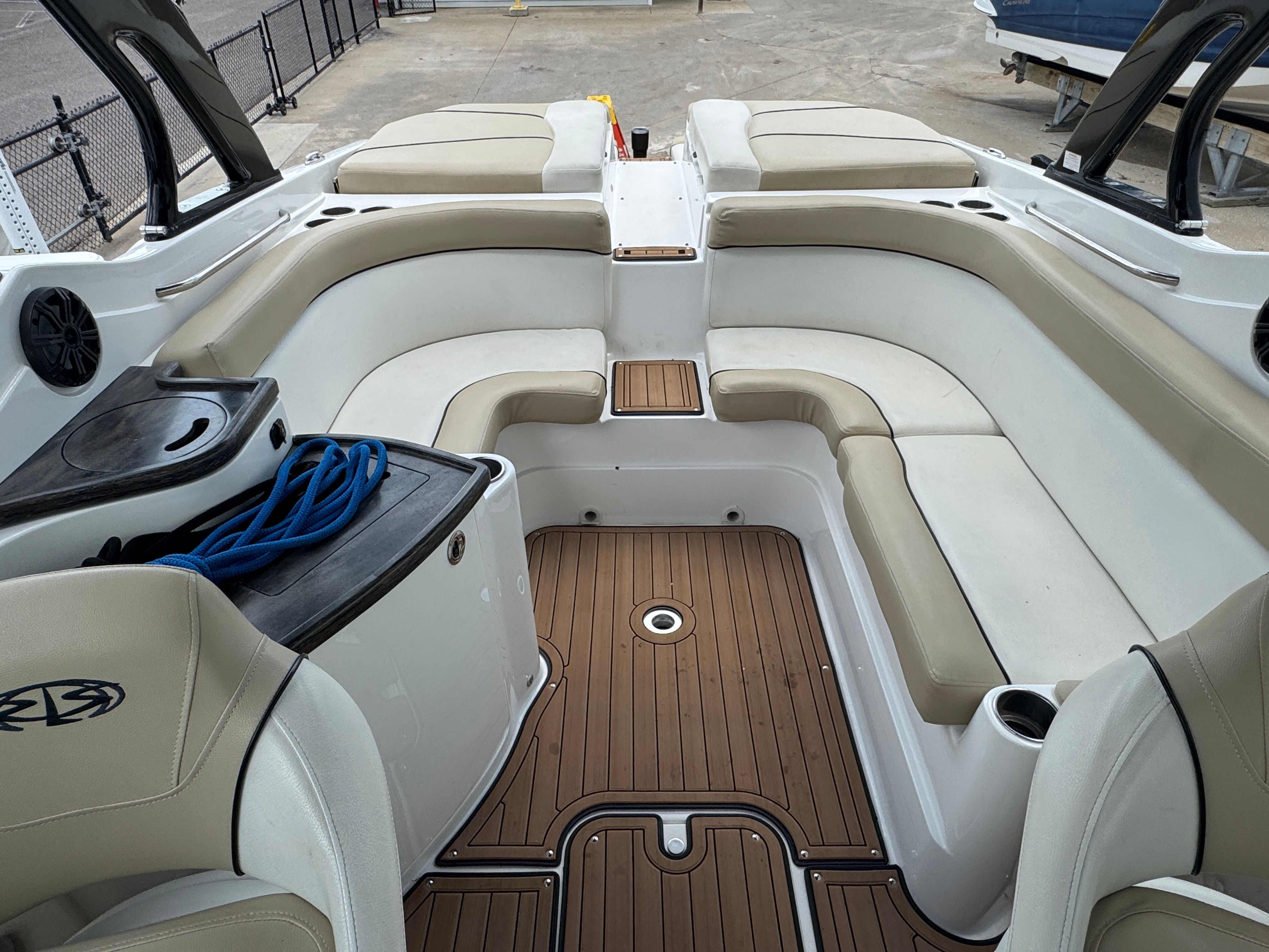 Interior of a 2017 Rinker QX29 BR boat with seating area.