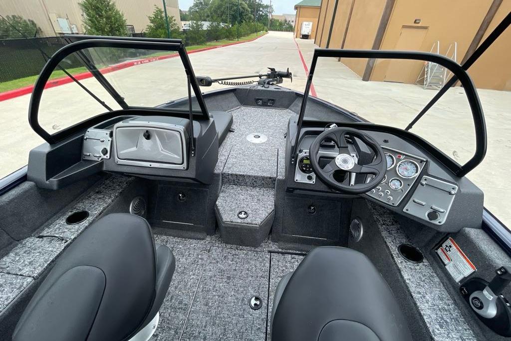 Interior view of 2026 Tracker Pro Guide V-175 Combo boat, featuring dual consoles and steering wheel.