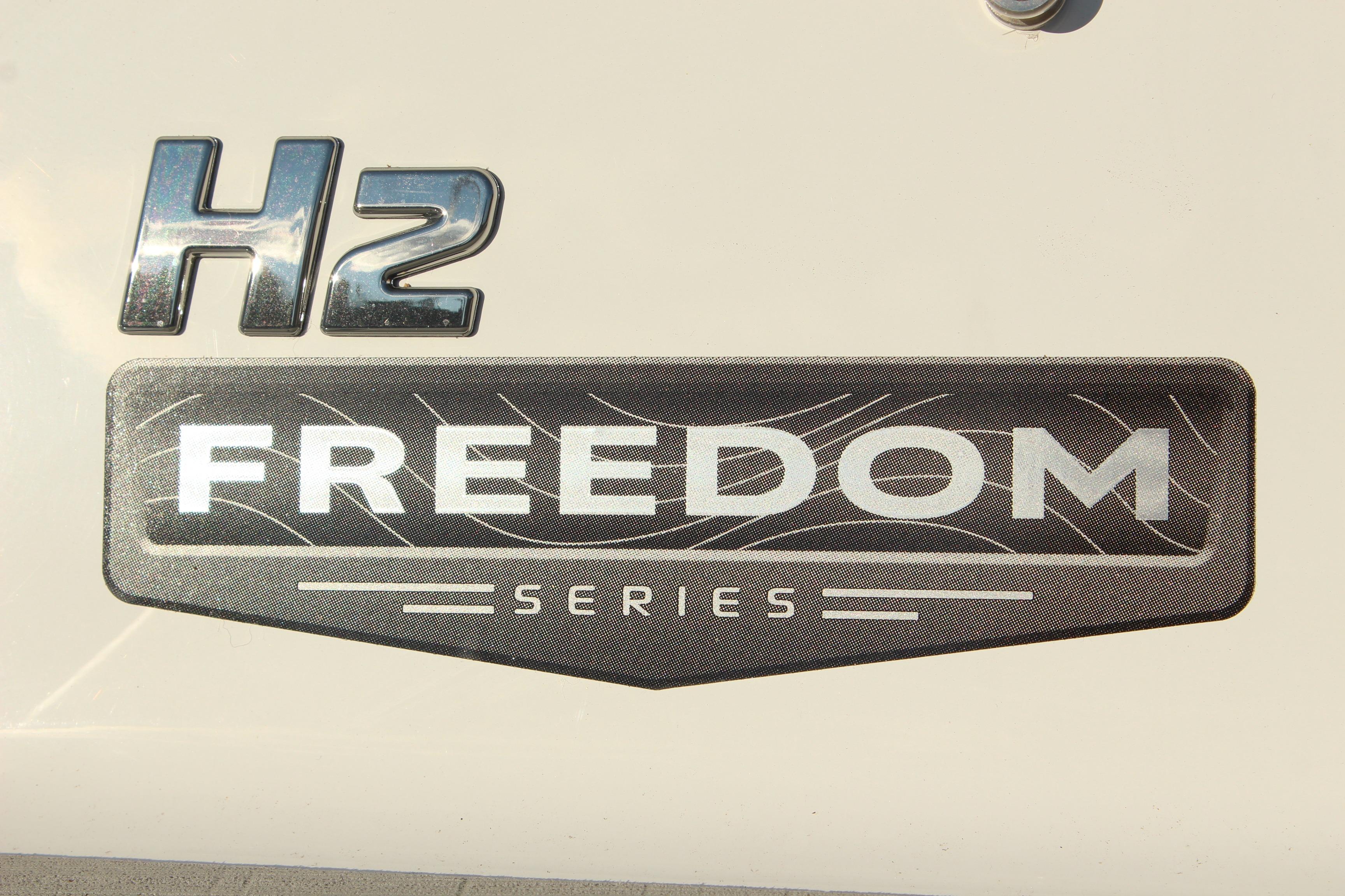 2026 Four Winns H2 Freedom Series logo on boat exterior.
