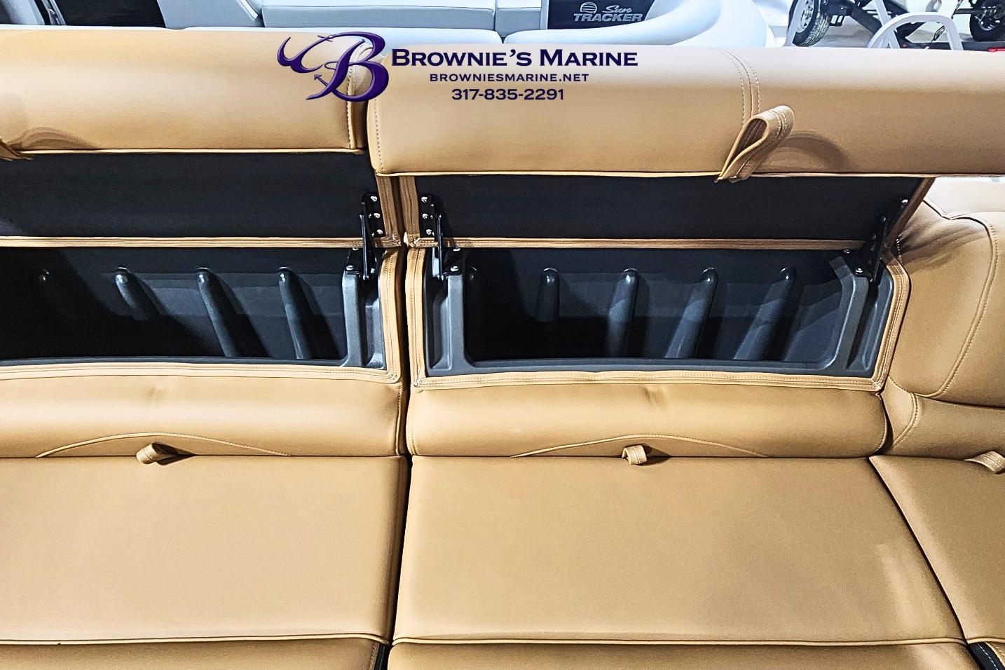 Tan leather seating with storage compartments in a 2026 Regency 250 DL boat.