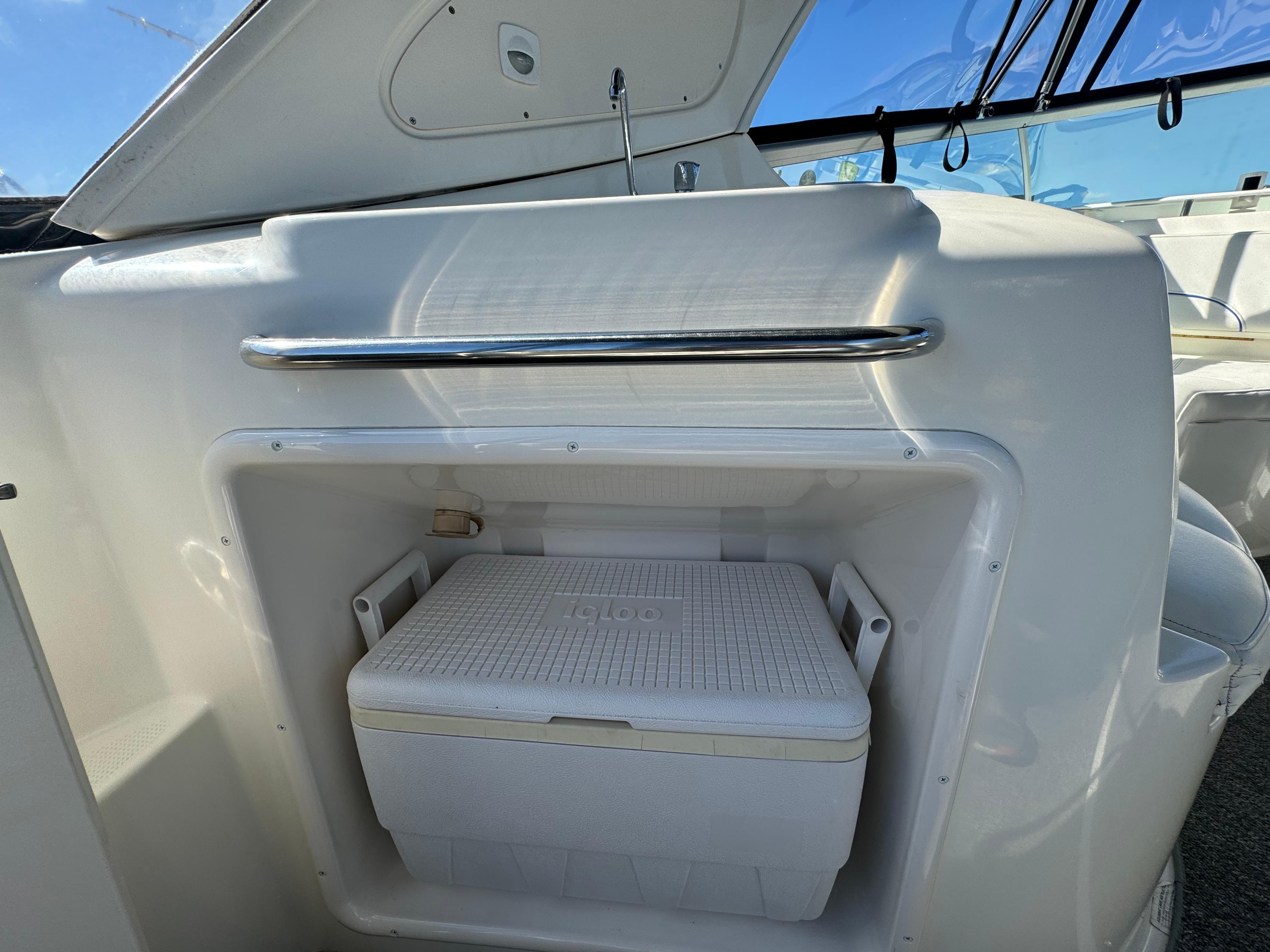 2008 Bayliner 300 Ciera interior with built-in cooler storage compartment.