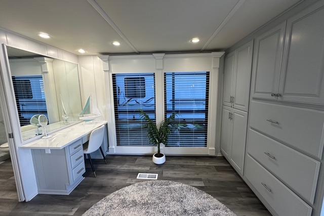 Luxurious interior of 1999 Sumerset 18x82 houseboat with modern decor and ample storage.