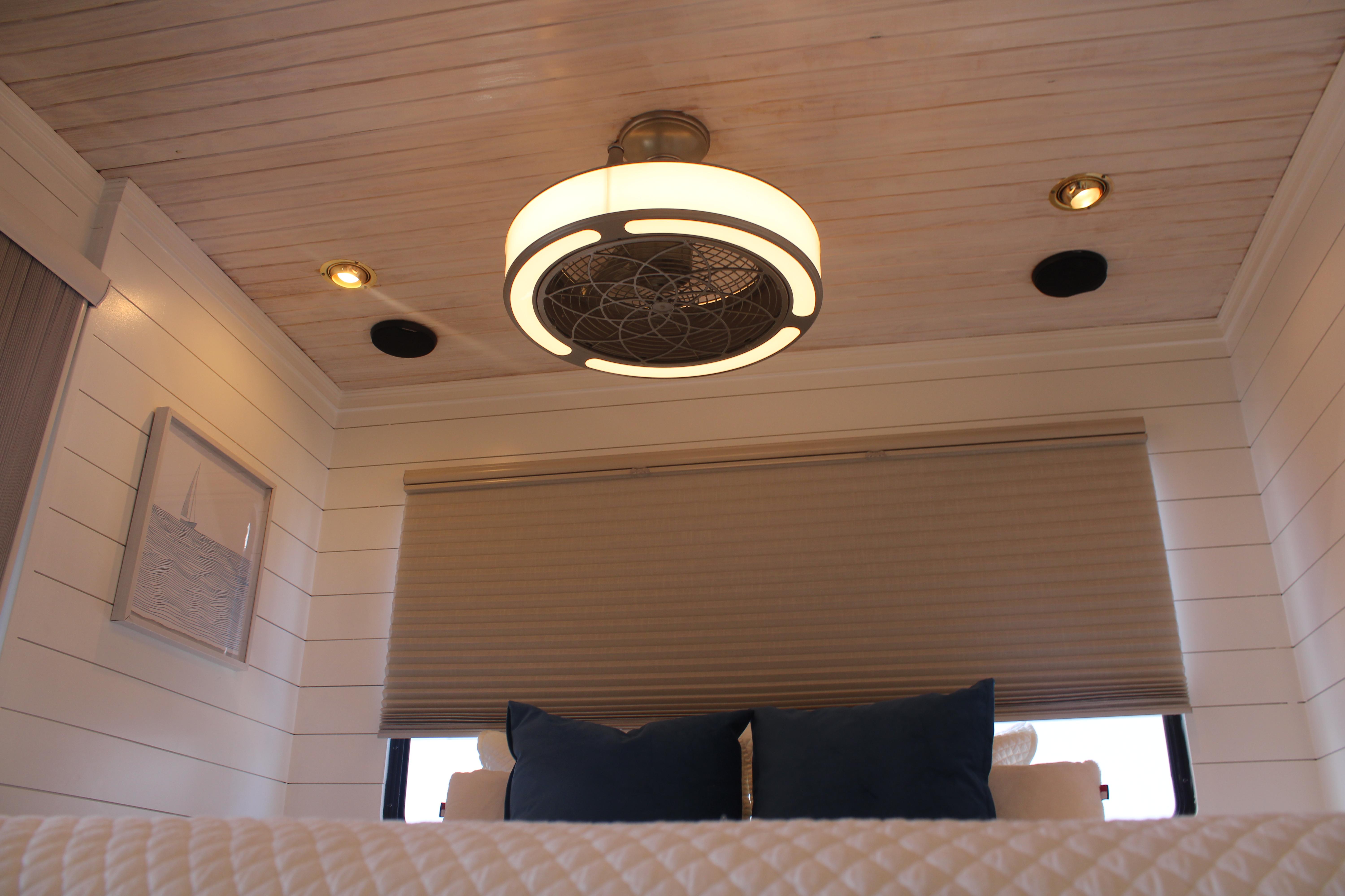 Interior of 1992 Sumerset 66 houseboat with modern ceiling fan and cozy decor.