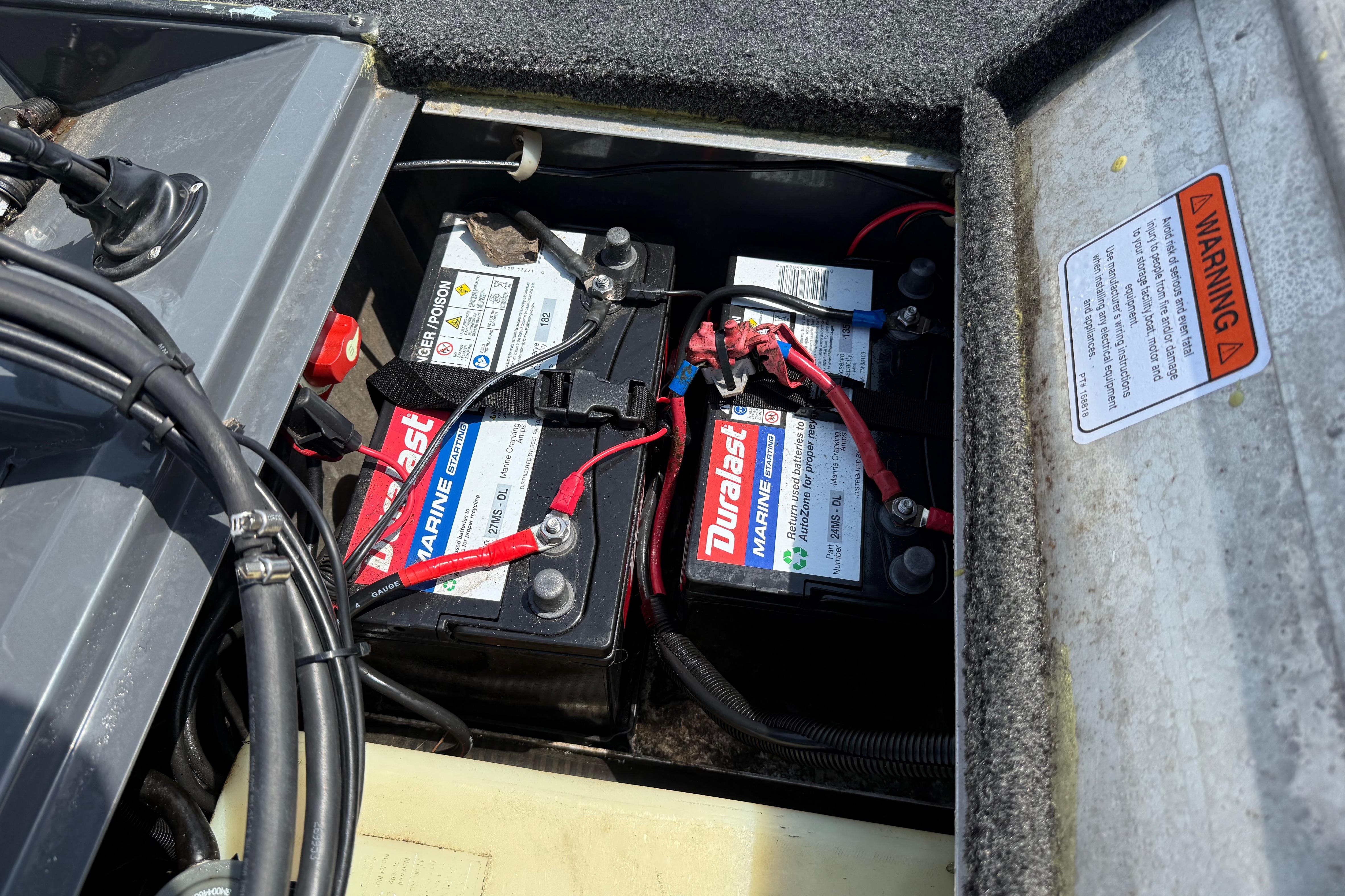 Batteries in a 2015 Tracker Pro Team 190 TX boat, featuring Duralast Marine labels.