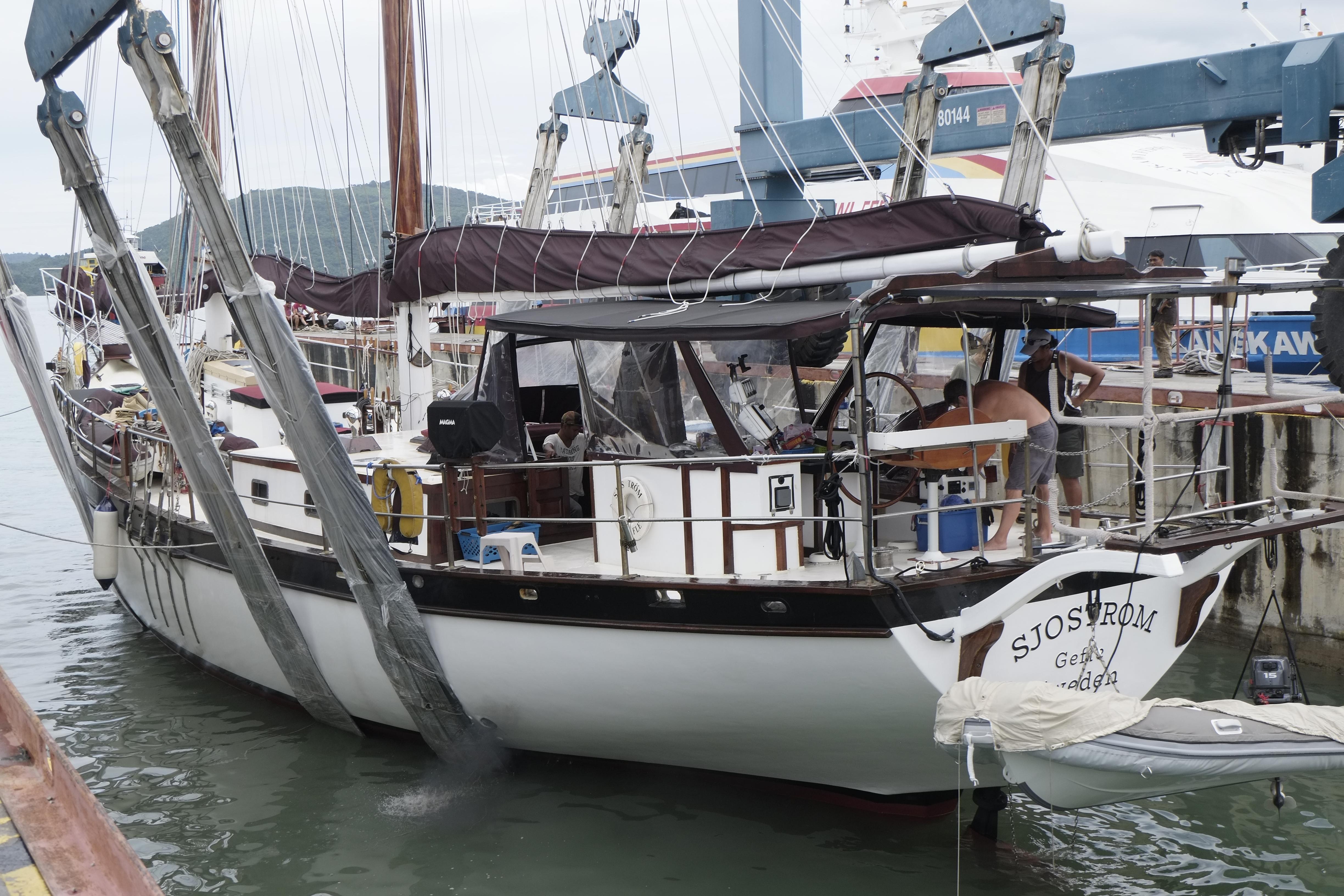 Custom Bud Macintosh schooner, 2006, docked at a marina with visible rigging and equipment.