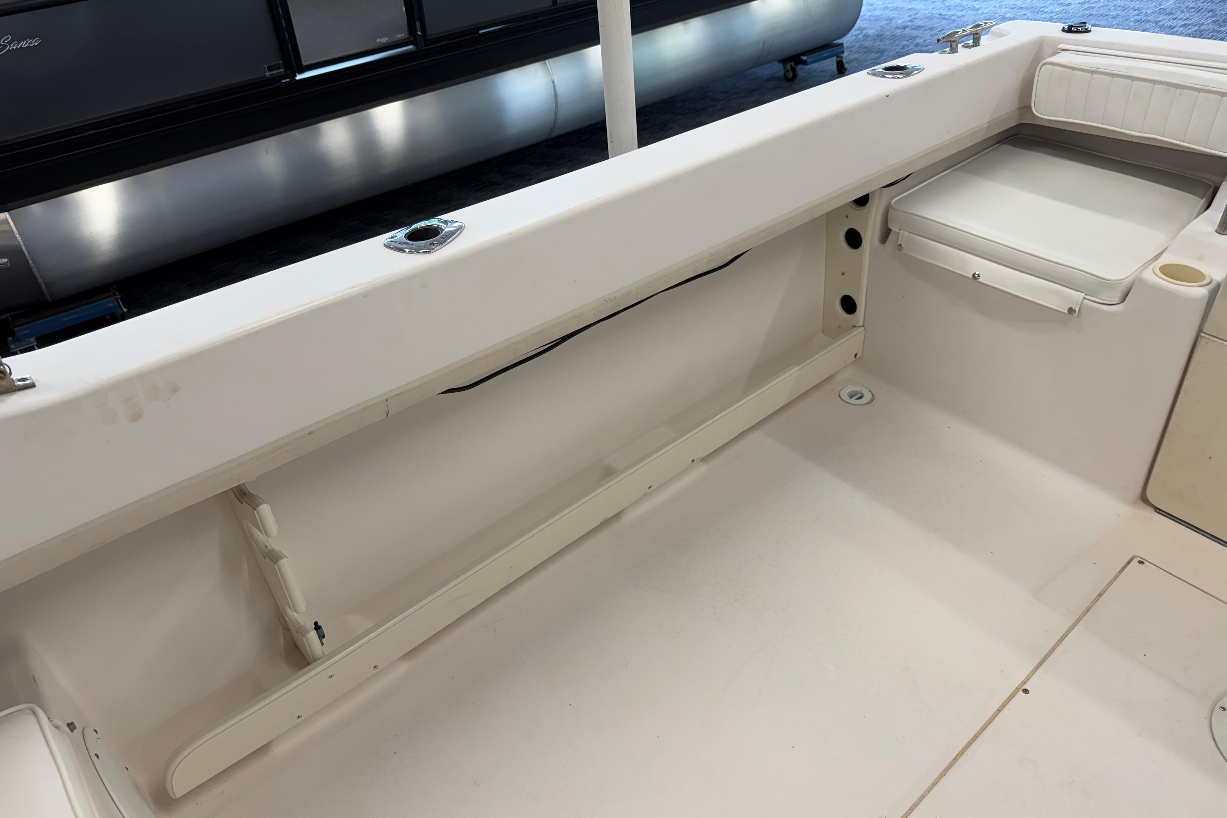 2001 Grady-White Tournament 223 boat interior with seating and rod holders.