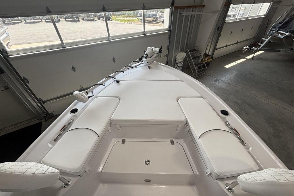2026 Sportsman Masters 247 Bay Boat interior with cushioned seating and storage compartments.
