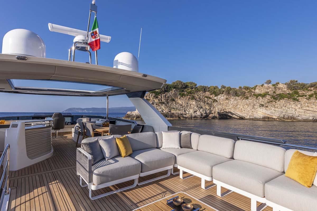Manufacturer Provided Image: Luxury deck of 2022 Absolute 64 Navetta yacht with scenic coastal view.
