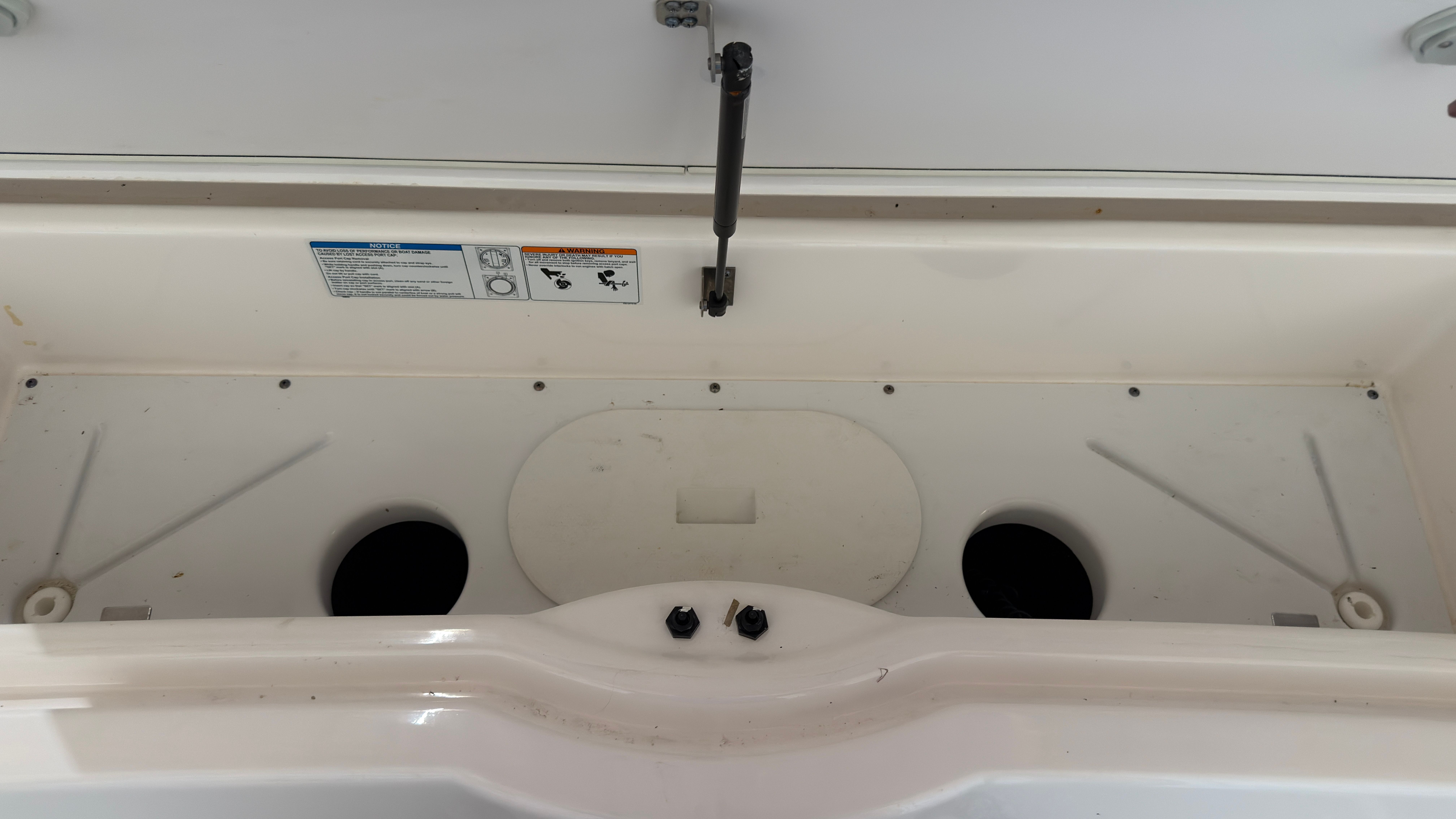 Interior of 2024 Yamaha AR220 boat, storage compartment view.