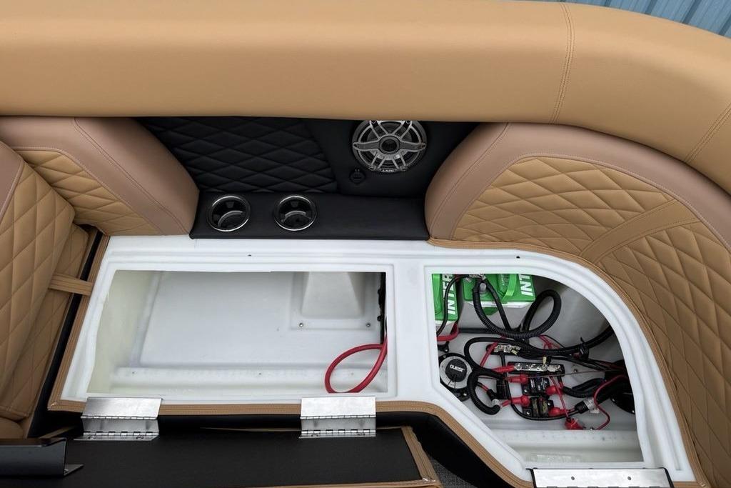Luxurious seating and storage in 2026 Godfrey Monaco 235 SFLC iMPACT boat.