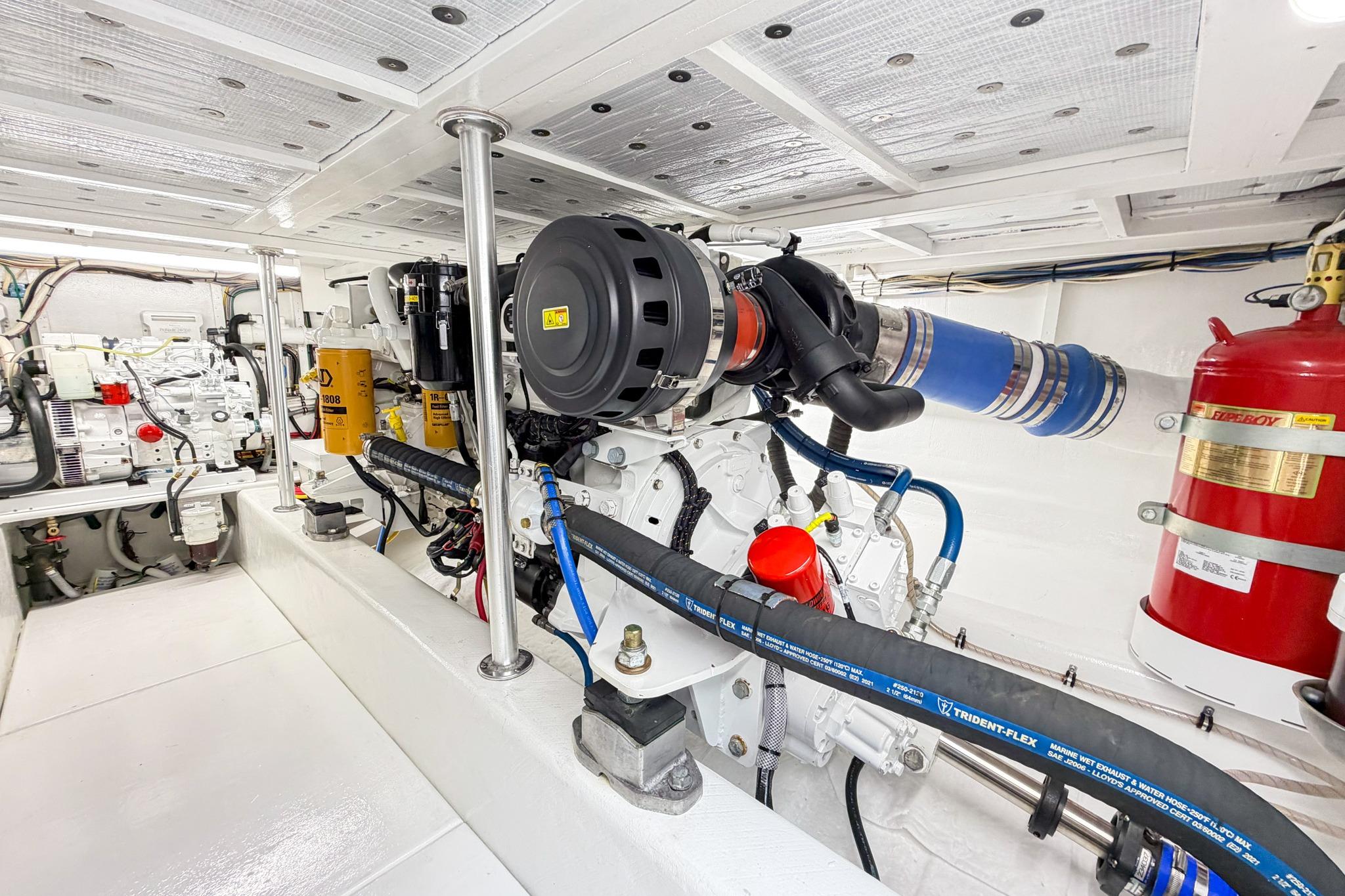 Engine room of a 1998 Blackwell Custom Carolina Sportfish boat, showcasing machinery and components.