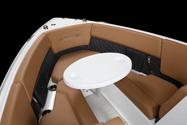 Manufacturer Provided Image: 2025 Four Winns H4 boat interior with brown seating and a white table.