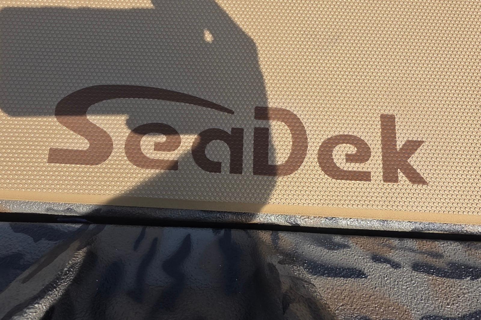 SeaDek logo on Xpress H18 Bass boat, 2026 model, textured surface.