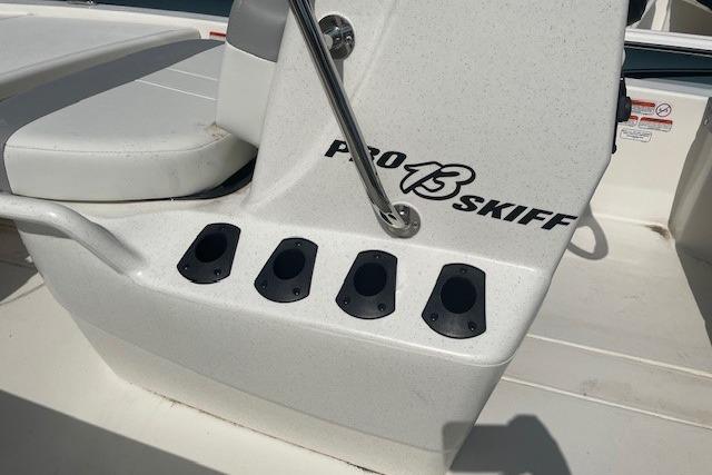2026 Mako Pro Skiff 13 CC boat console with rod holders and seating.