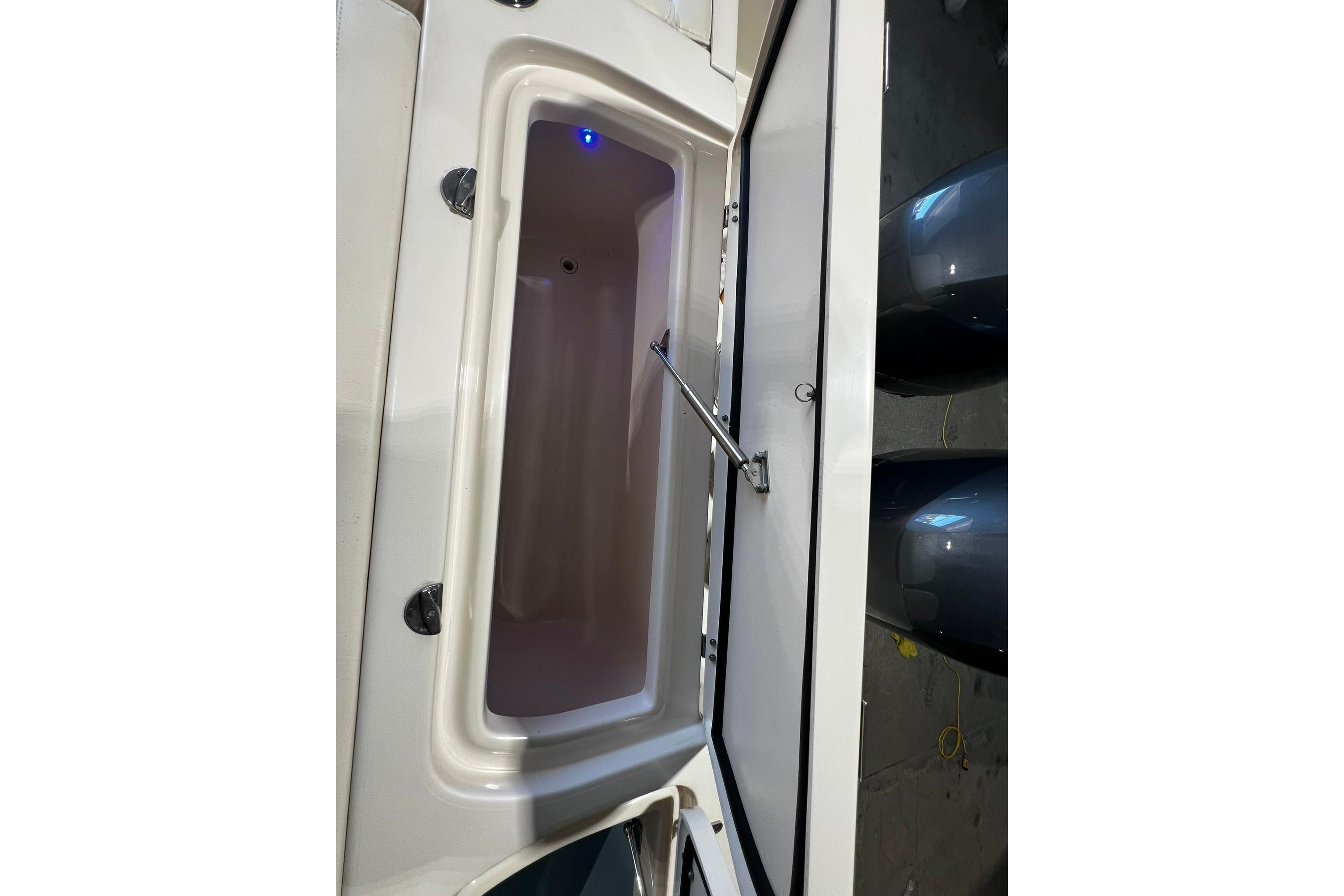 Open storage compartment on 2014 Grady-White Freedom 275 boat.