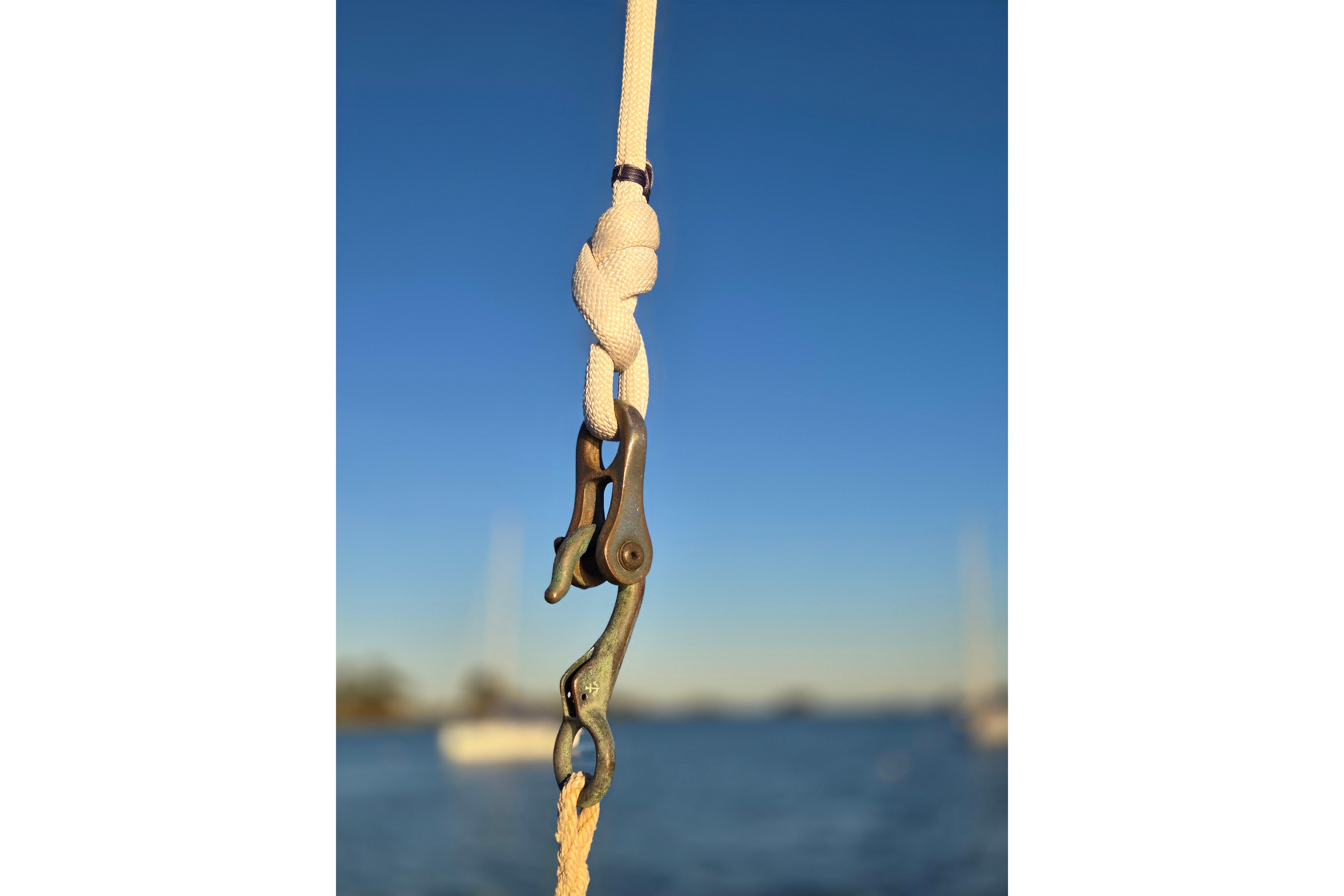 Close-up of a rope and shackle on a 1970 Hinckley Bermuda 40 sailboat.