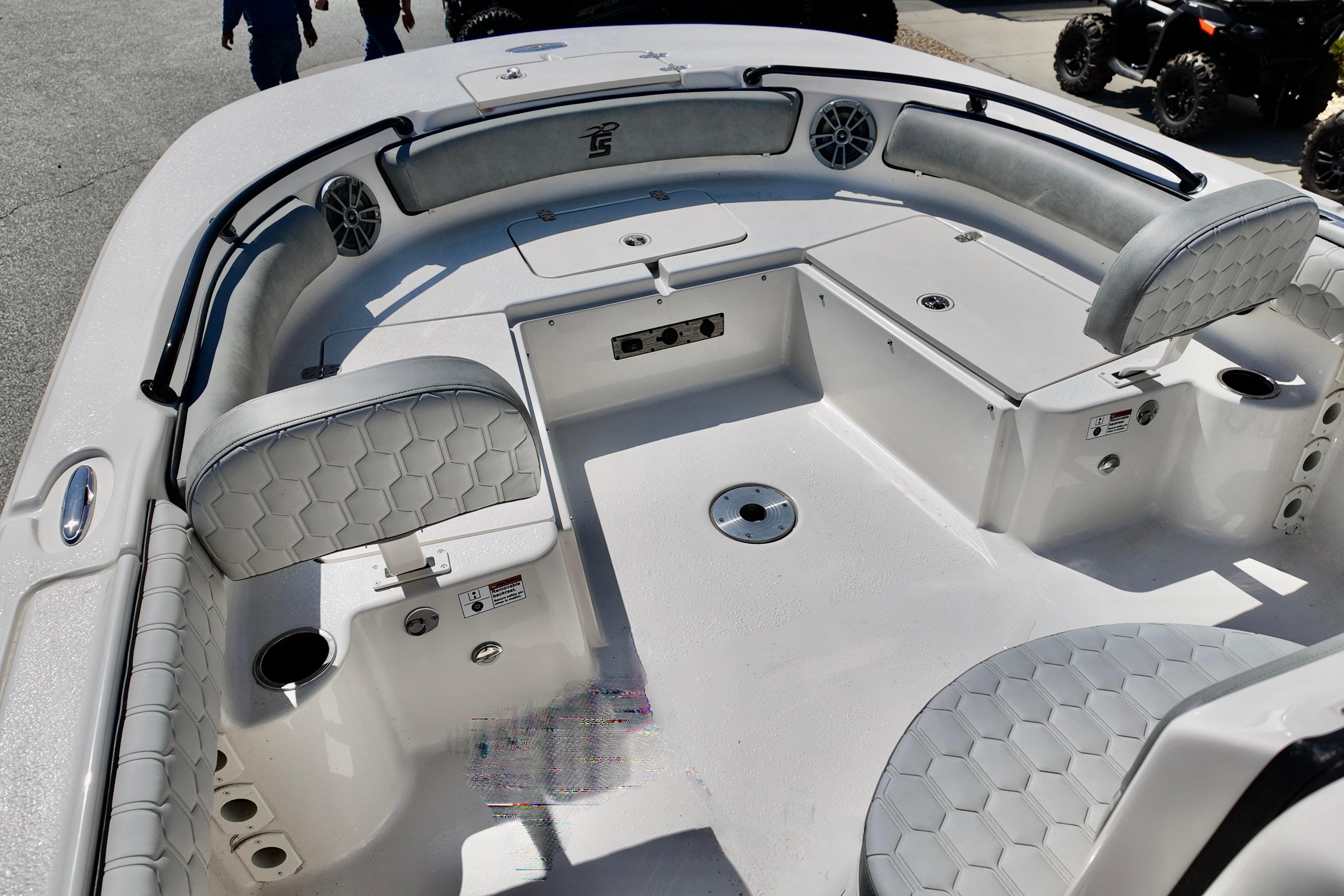 2026 Carolina Skiff 21 Ultra Elite boat interior with seating and storage compartments.