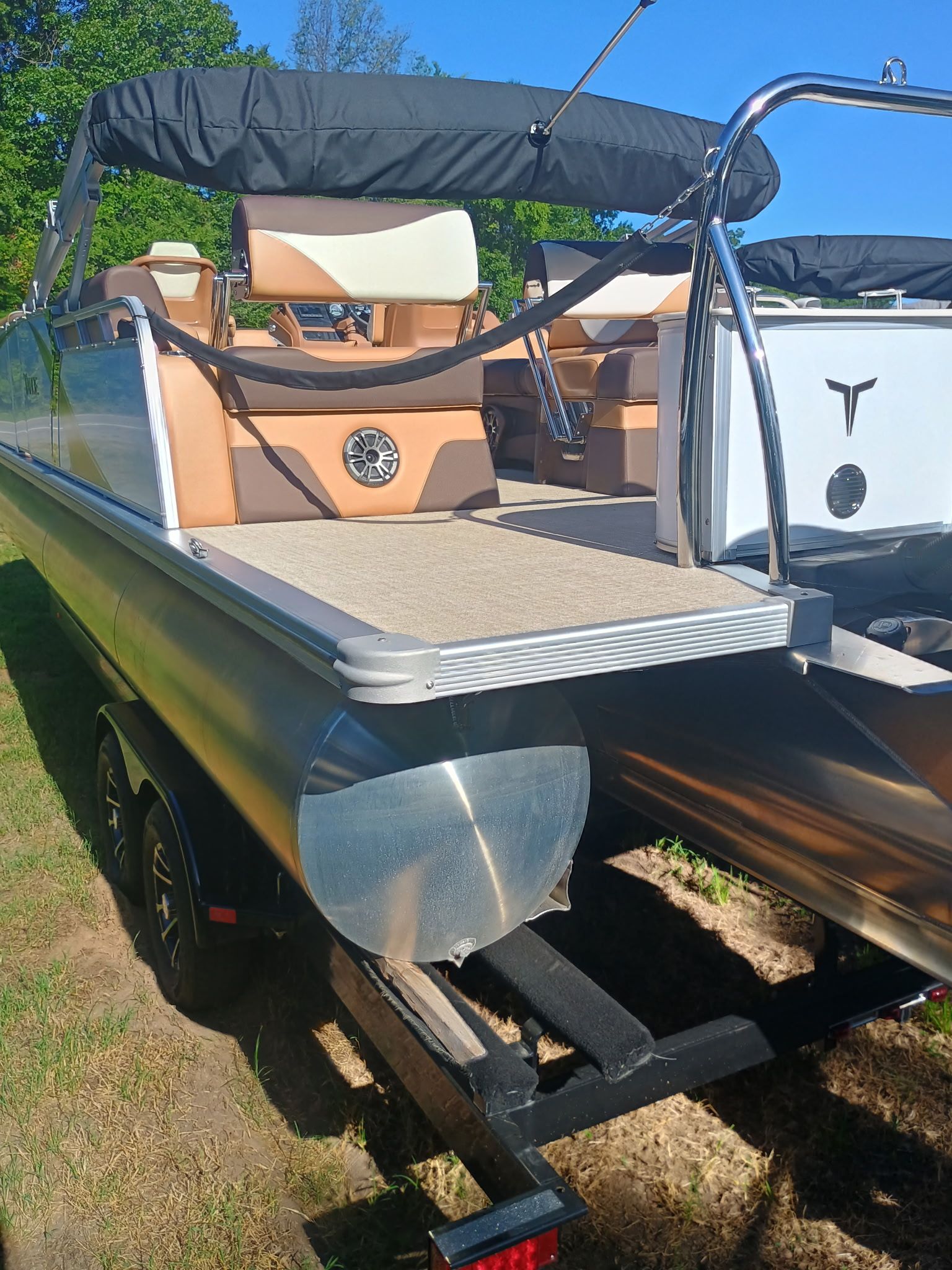 2025 Tahoe LTZ Quad Lounger Shift pontoon boat on trailer.