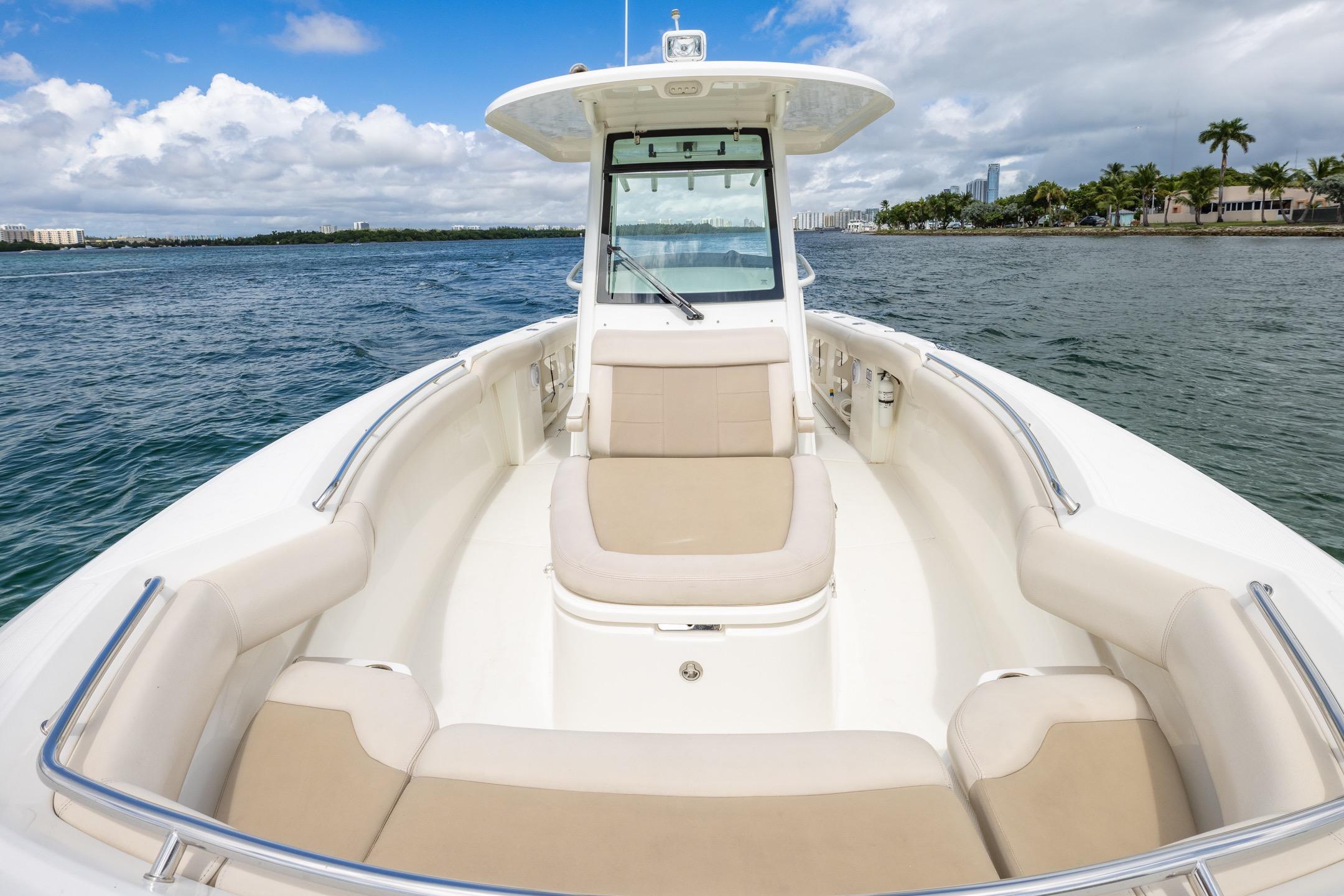 2016 Boston Whaler 280 Outrage boat on water, featuring spacious seating and sleek design.