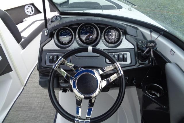 Dashboard of a 2019 Monterey 218SS Super Sport boat with steering wheel and gauges.