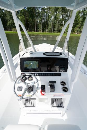 2024 Sea Hunt Ultra 234 boat console with steering wheel and navigation system.