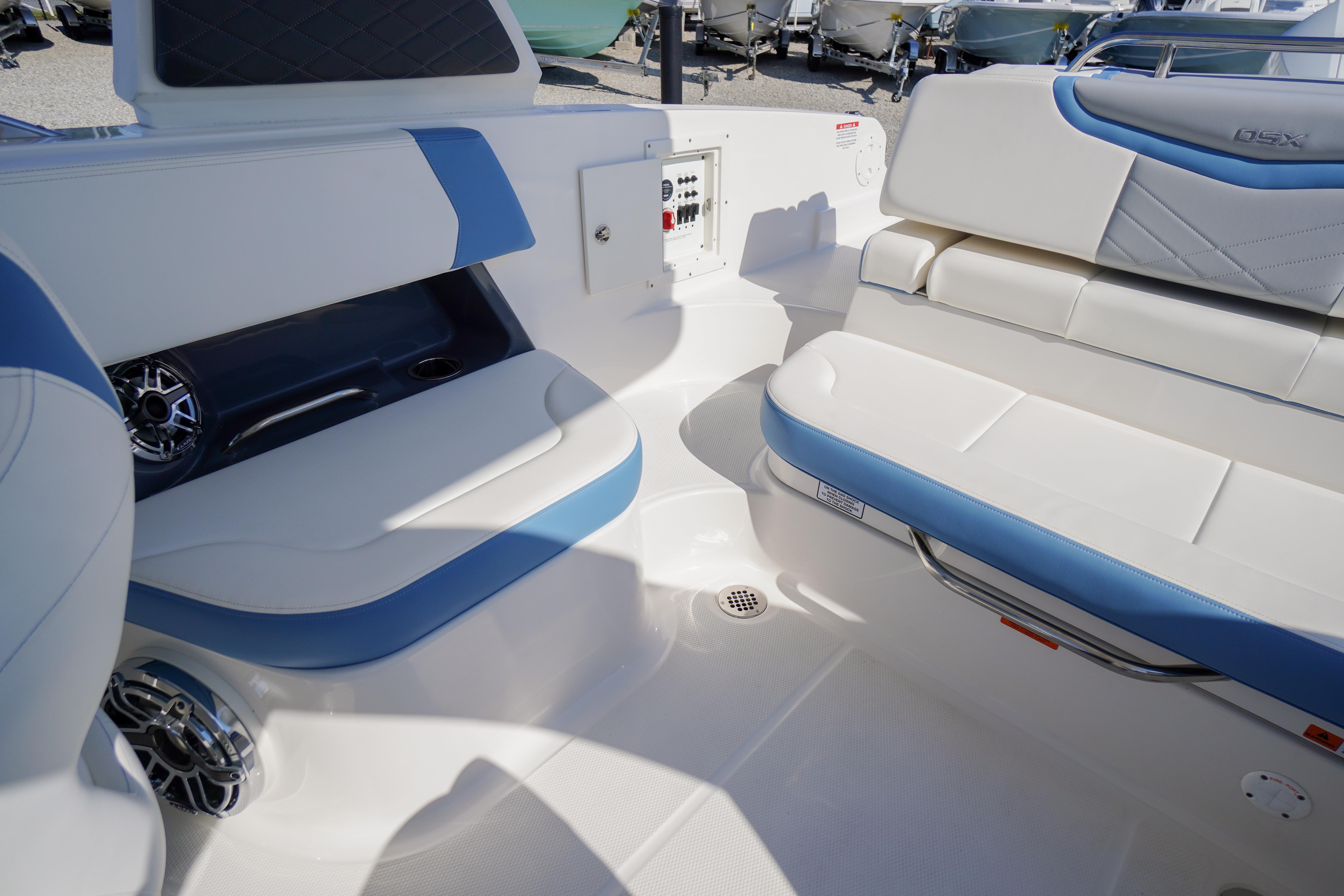 Interior seating of 2026 Chaparral 270 OSX boat with blue and white upholstery.