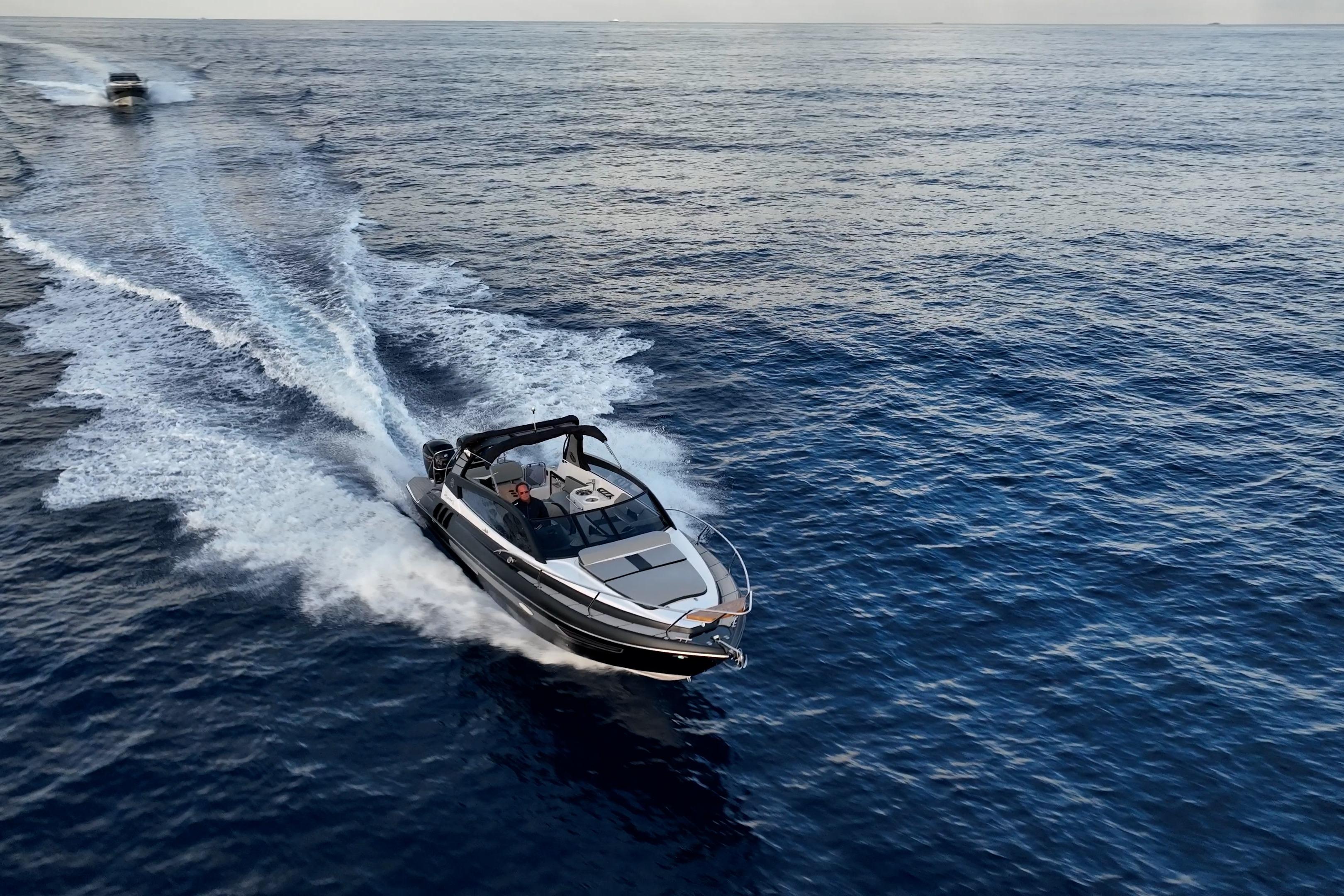 A 2027 Hanover 305 boat cruising swiftly on open water.