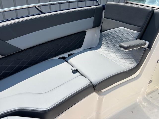 2026 Chaparral SSX 6 boat interior with gray and black cushioned seating.