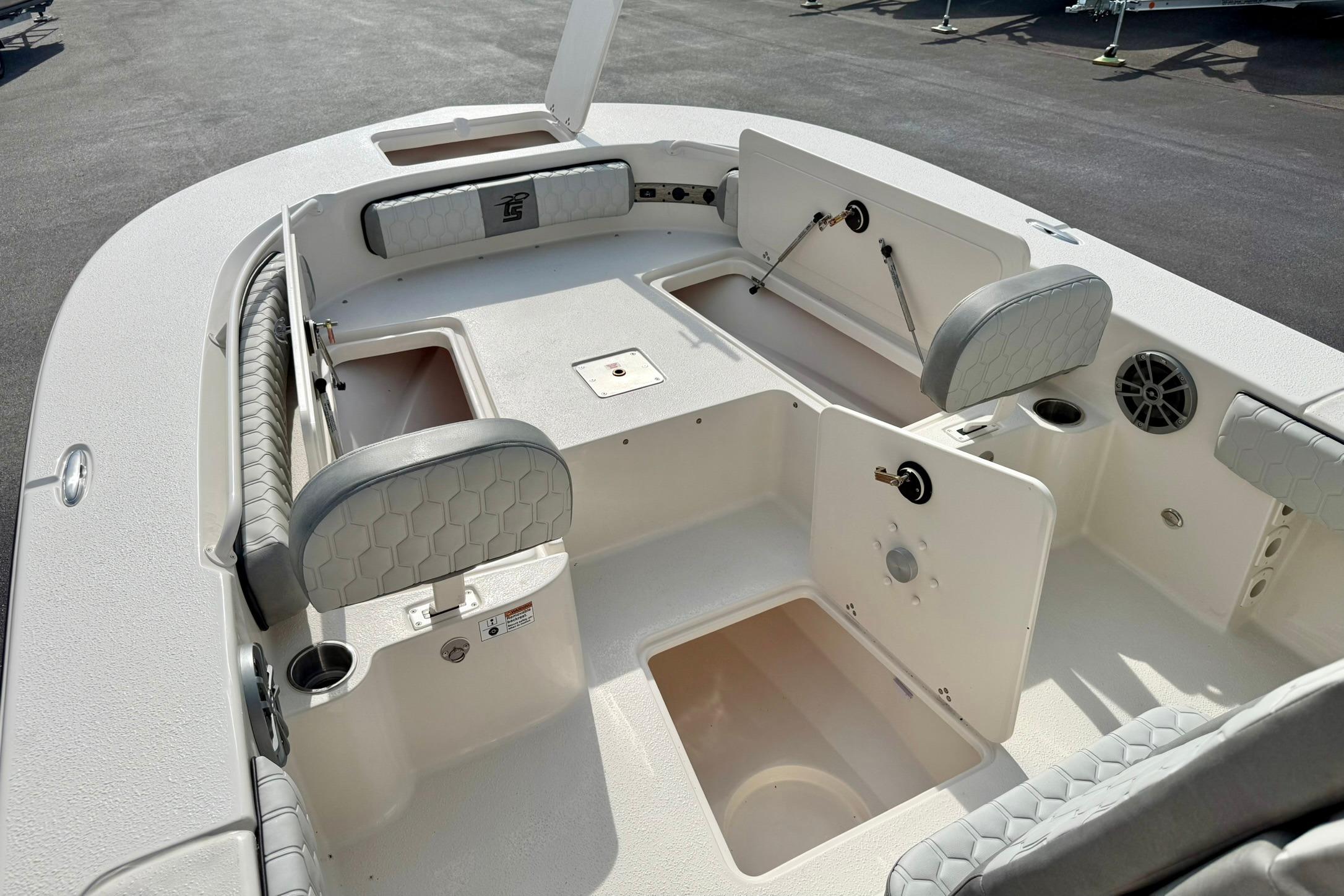 2026 Carolina Skiff 24 Ultra Elite boat interior with seating and storage compartments.