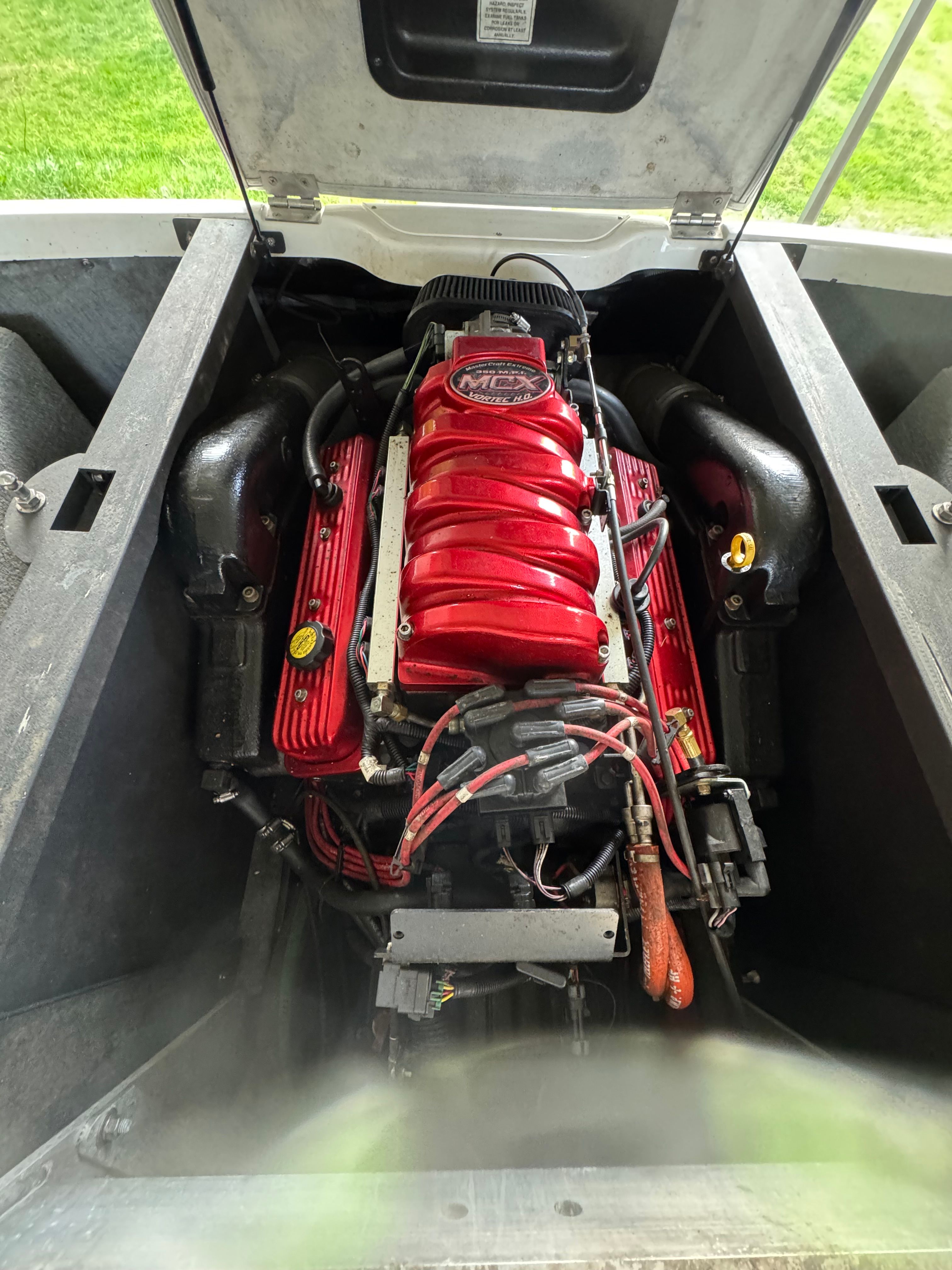Engine compartment of a 2003 MasterCraft X2 with a red engine block.