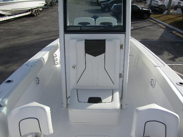 2025 Wellcraft 243 Fisherman boat interior, featuring sleek white seating and modern design.