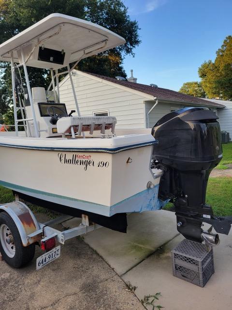 1995 KenCraft Challenger 190 boat on trailer, featuring outboard motor and canopy.
