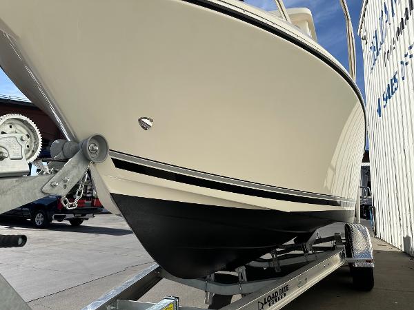 2023 Defiance Admiral 220 EX boat on trailer, side view.