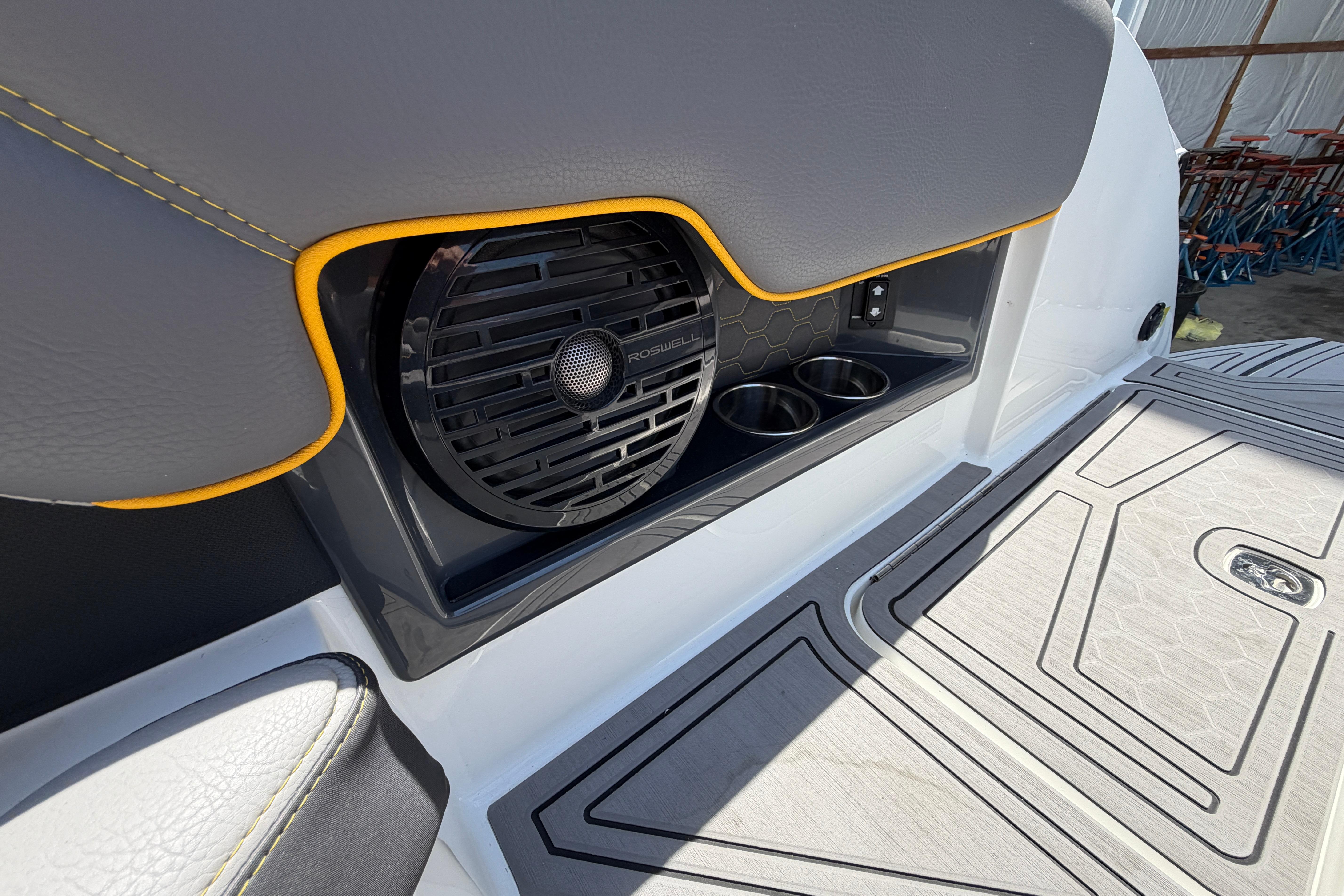 2021 Cobalt R8 Surf boat interior with speaker and cup holders.