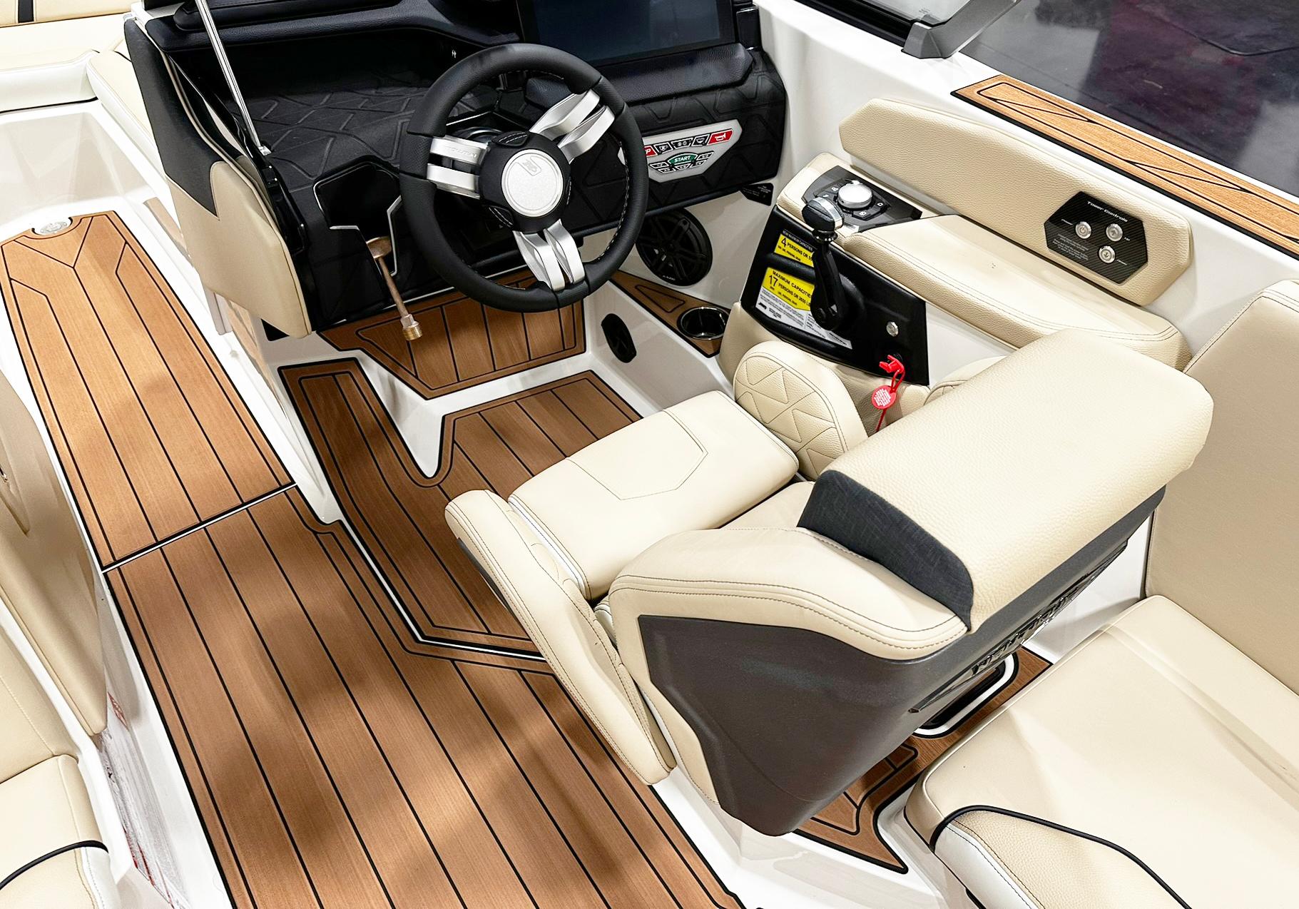 2026 Nautique GS24 boat interior with luxurious seating and modern dashboard design.