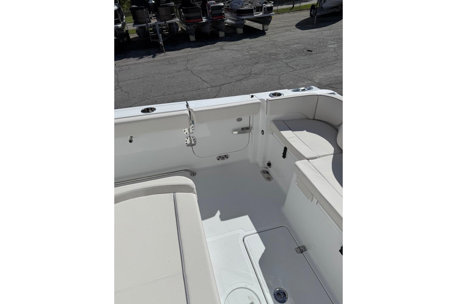 2026 Sea Hunt Ultra 285 Coffin Box boat interior with seating and storage.