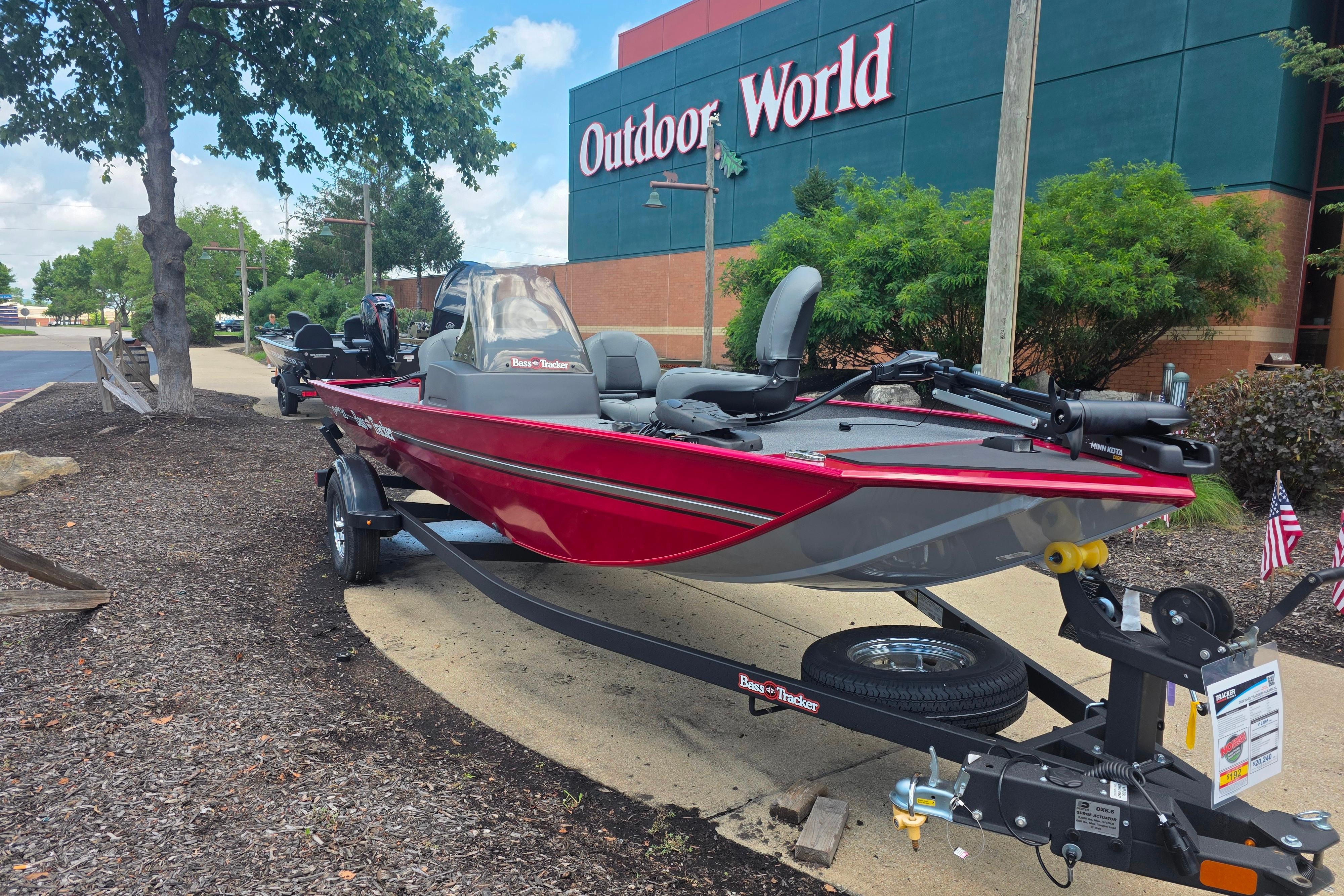 2026 Tracker Bass Tracker Classic XL boat displayed outside Outdoor World store.