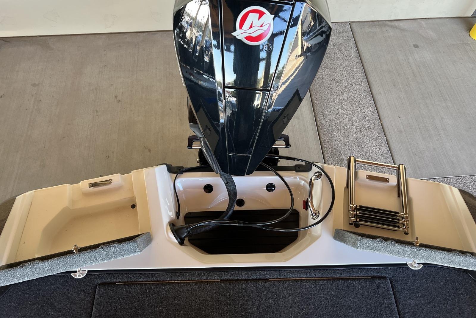 2025 Ranger 212LS boat with outboard motor and foldable ladder.