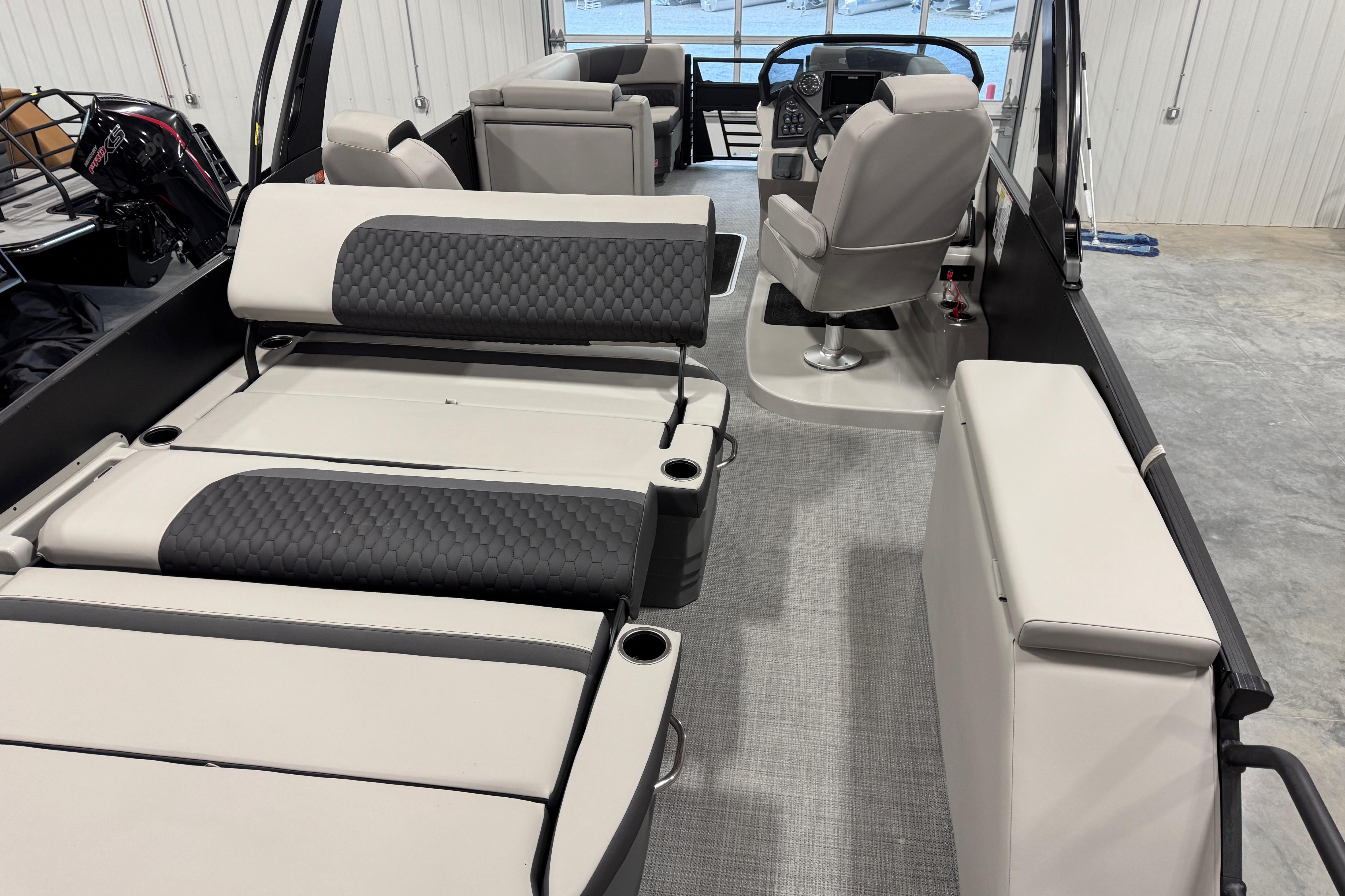 2026 Sylvan L-5 Platinum boat interior with luxurious seating and modern helm.