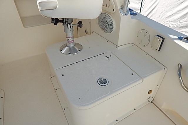 2003 World Cat 270 EC boat interior with seating and storage compartment.