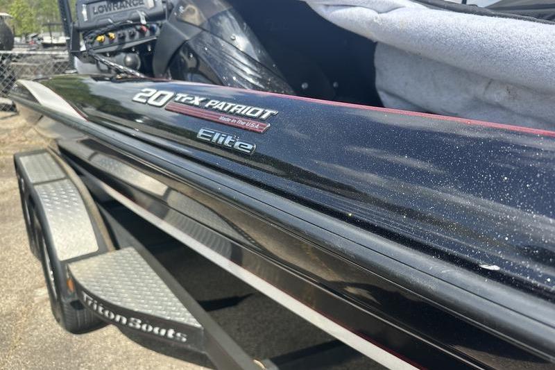2016 Triton 20 TrX Patriot Elite boat on trailer, close-up view.