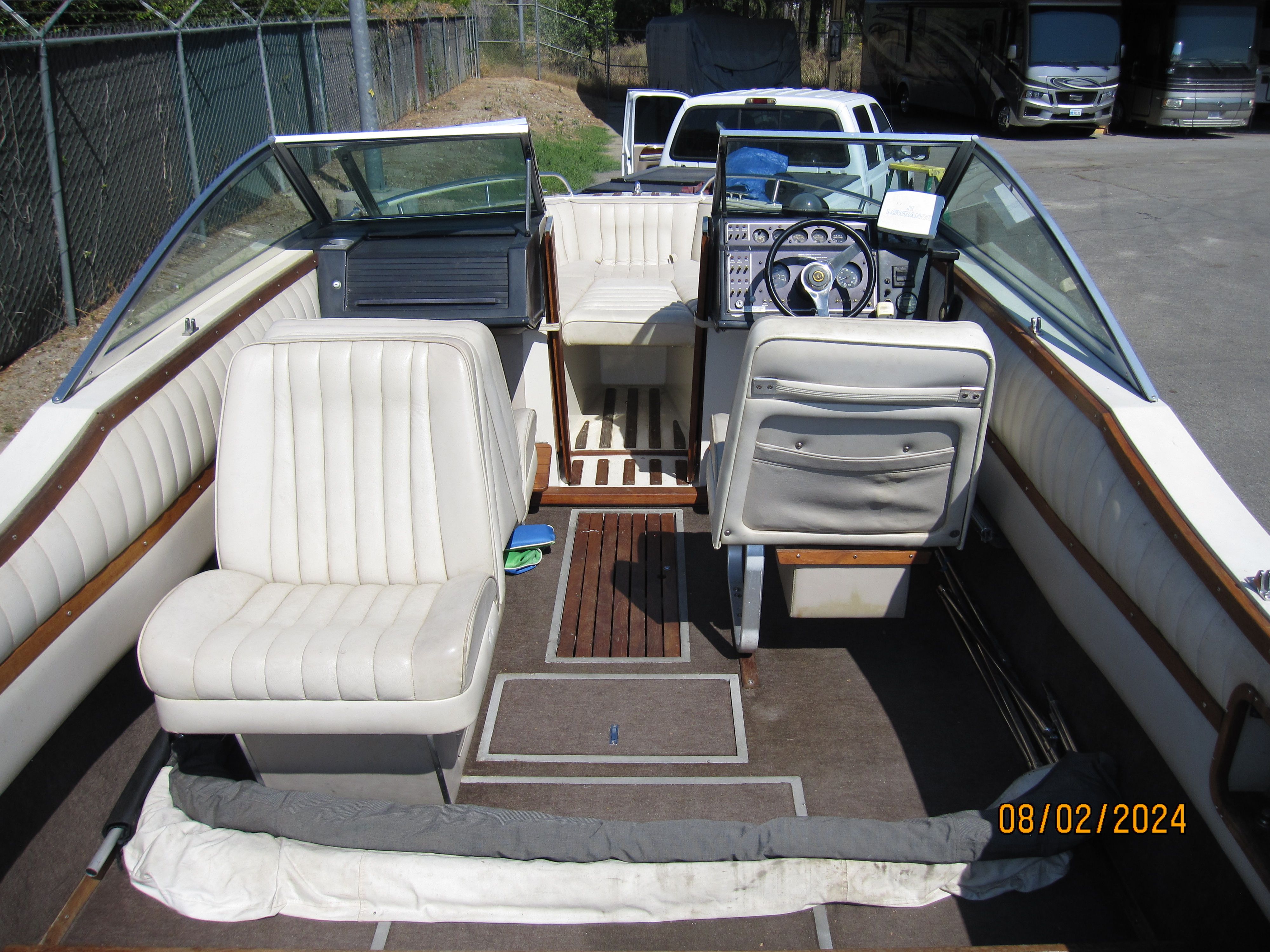 Interior of a 1990 Cobalt Bowrider Classic boat with white seats.